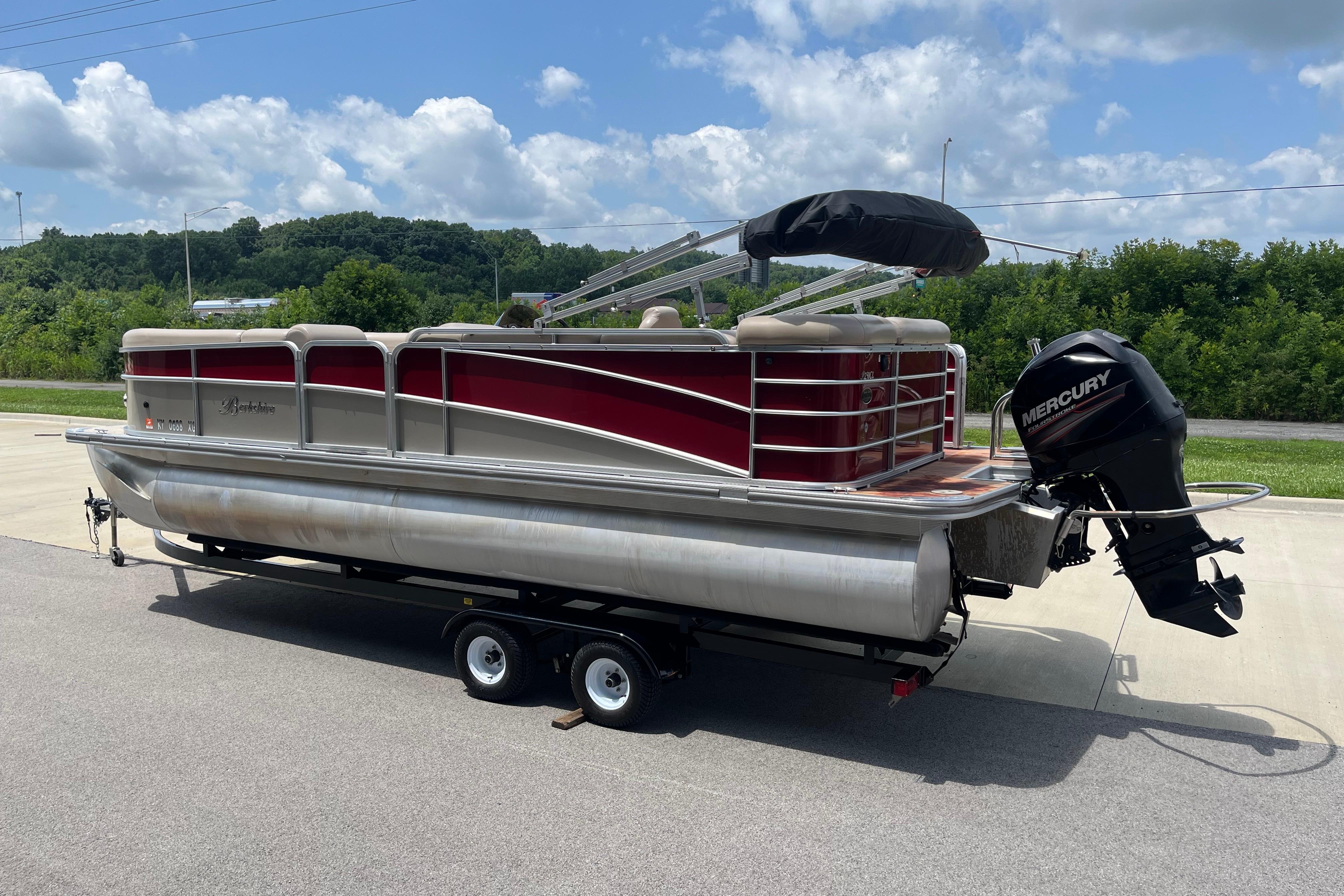 2013 Berkshire 230CL CTS pontoon boat with Mercury outboard motor on trailer.