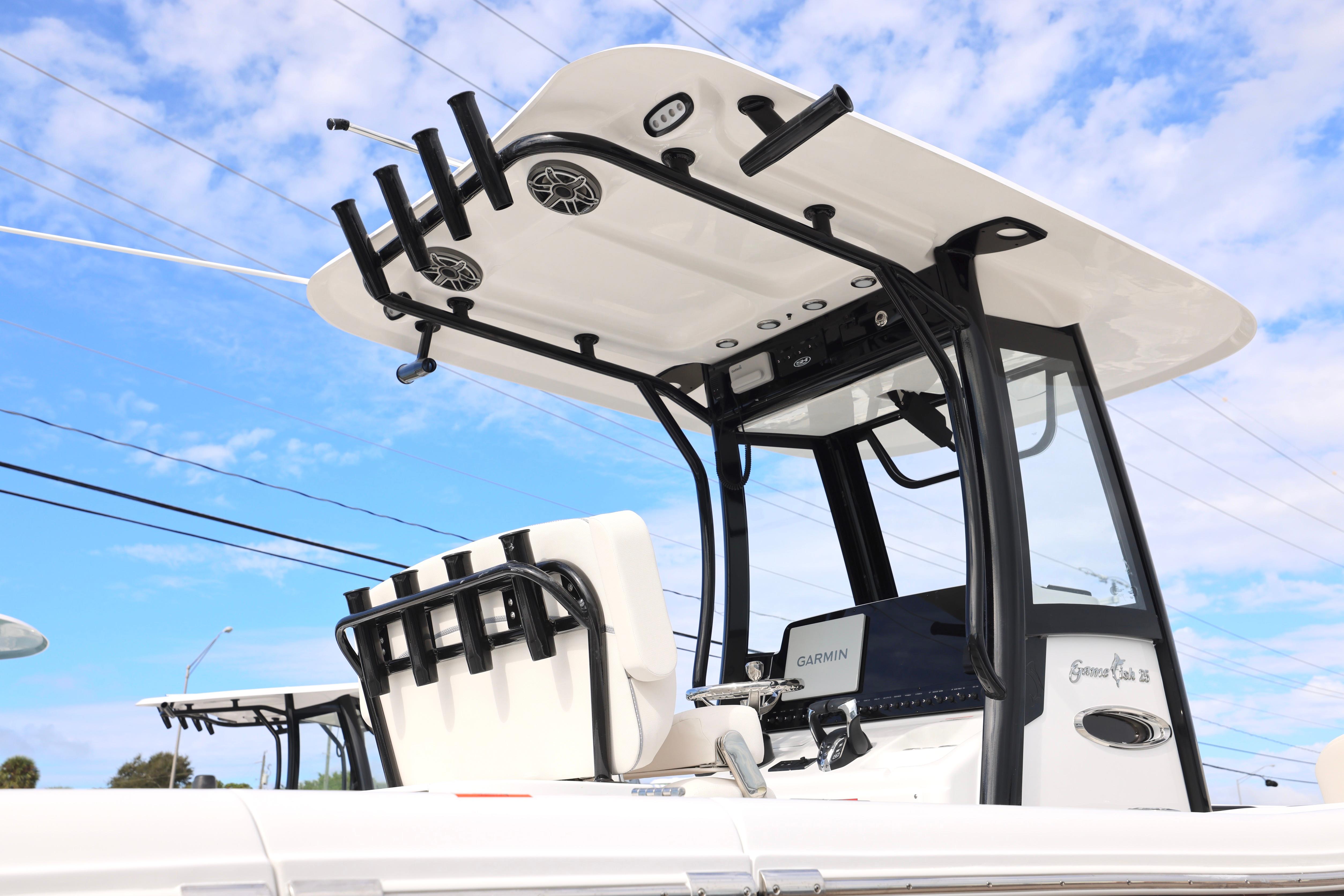 2026 Sea Hunt Gamefish 25 boat with T-top and Garmin electronics against blue sky.
