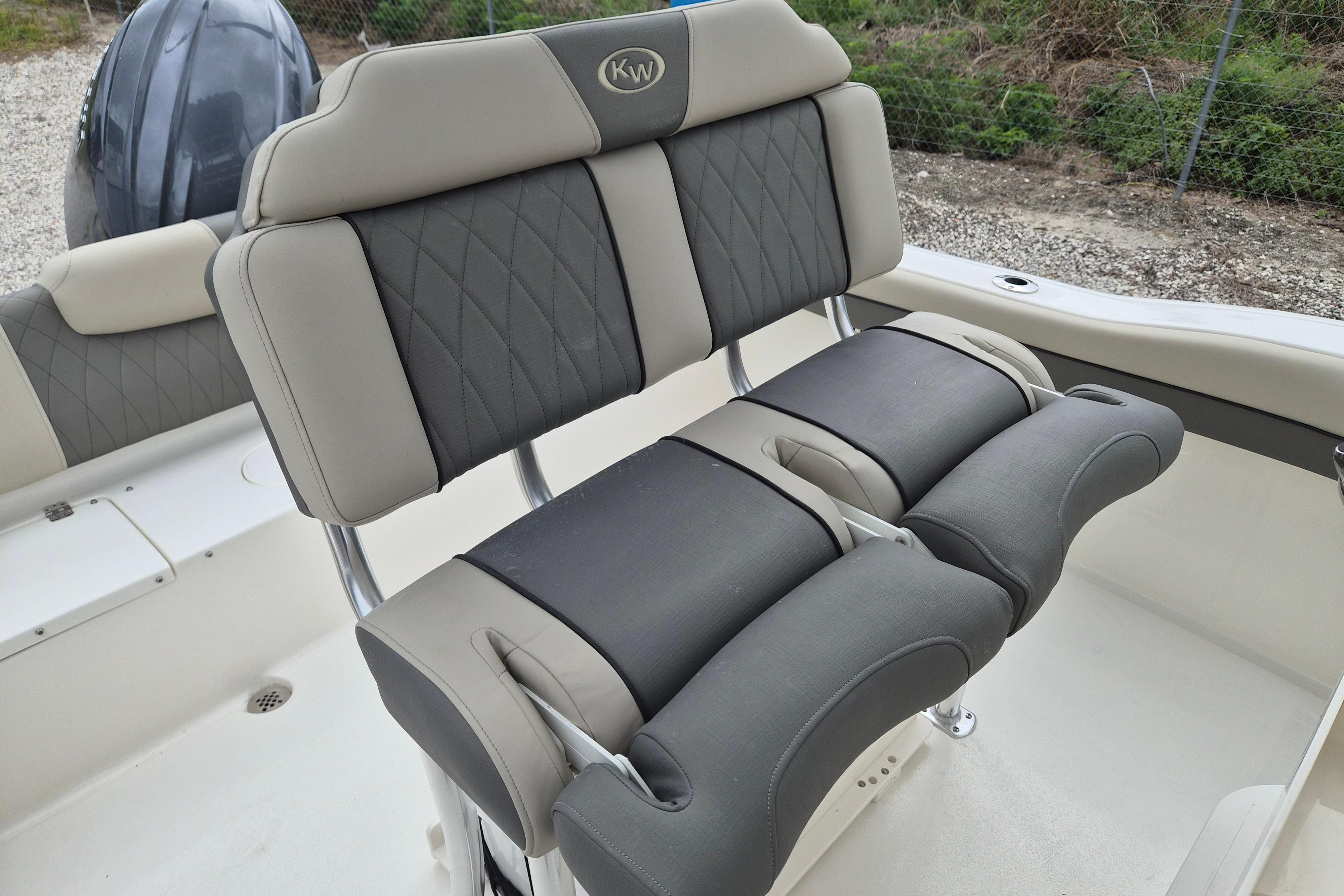 2026 Key West 219 FS boat seating with cushioned backrests and armrests.