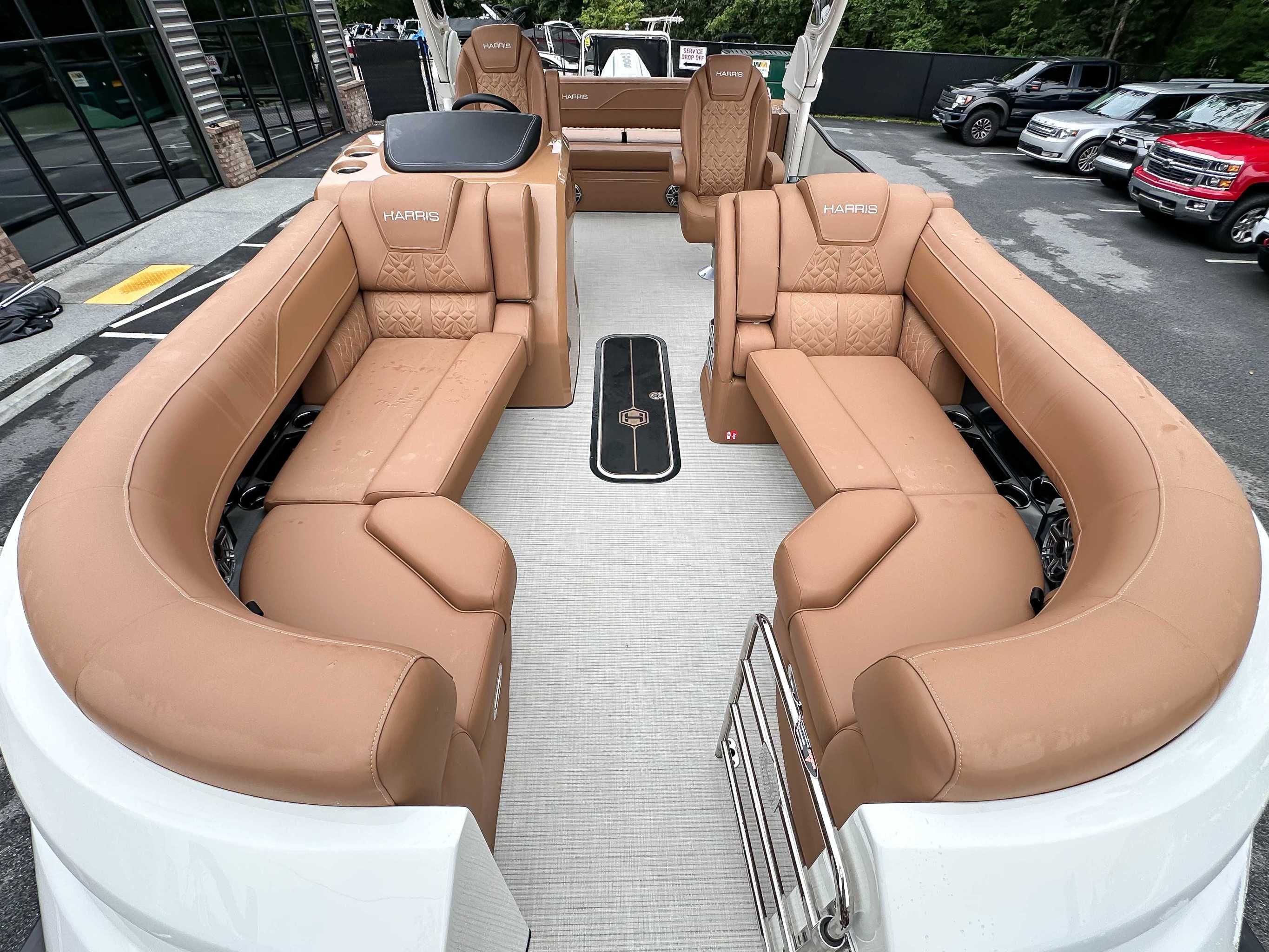 Interior of 2025 Harris Grand Mariner 230 SLDH with luxurious leather seating.