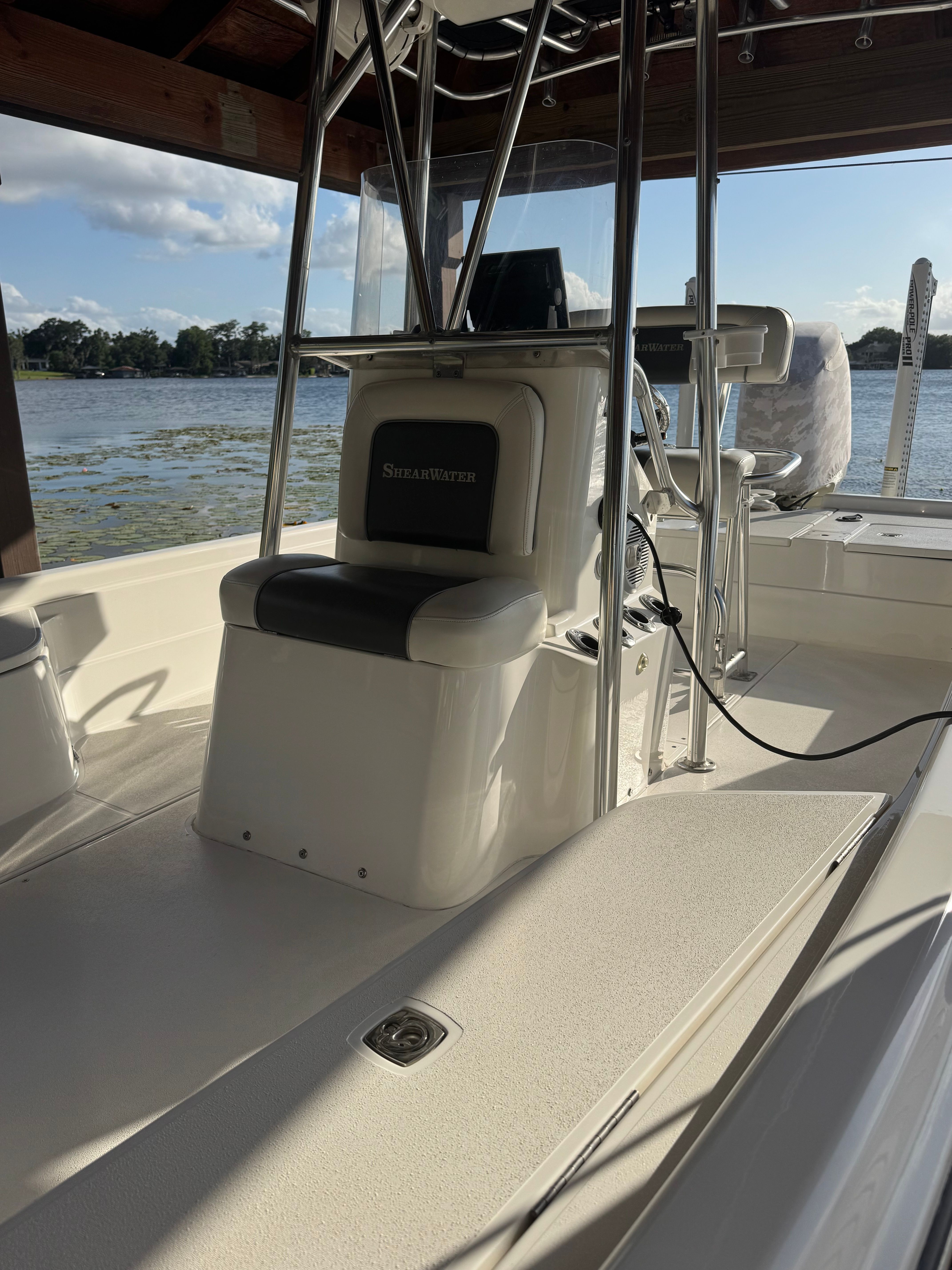 Interior view of a 2004 ShearWater LTZ boat by the lake.