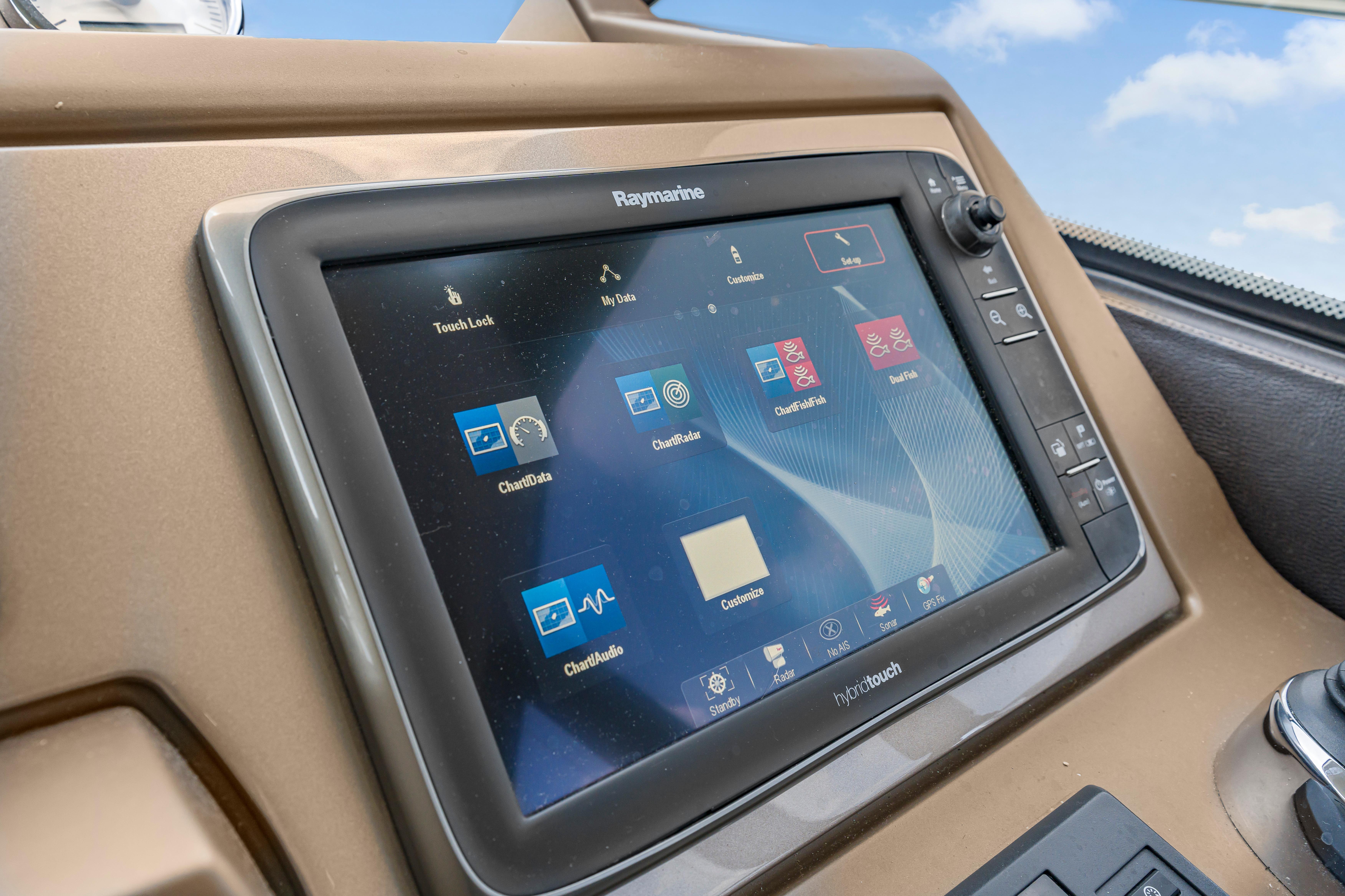 Raymarine navigation display on 2017 Prestige 500 yacht dashboard, showing various marine applications.
