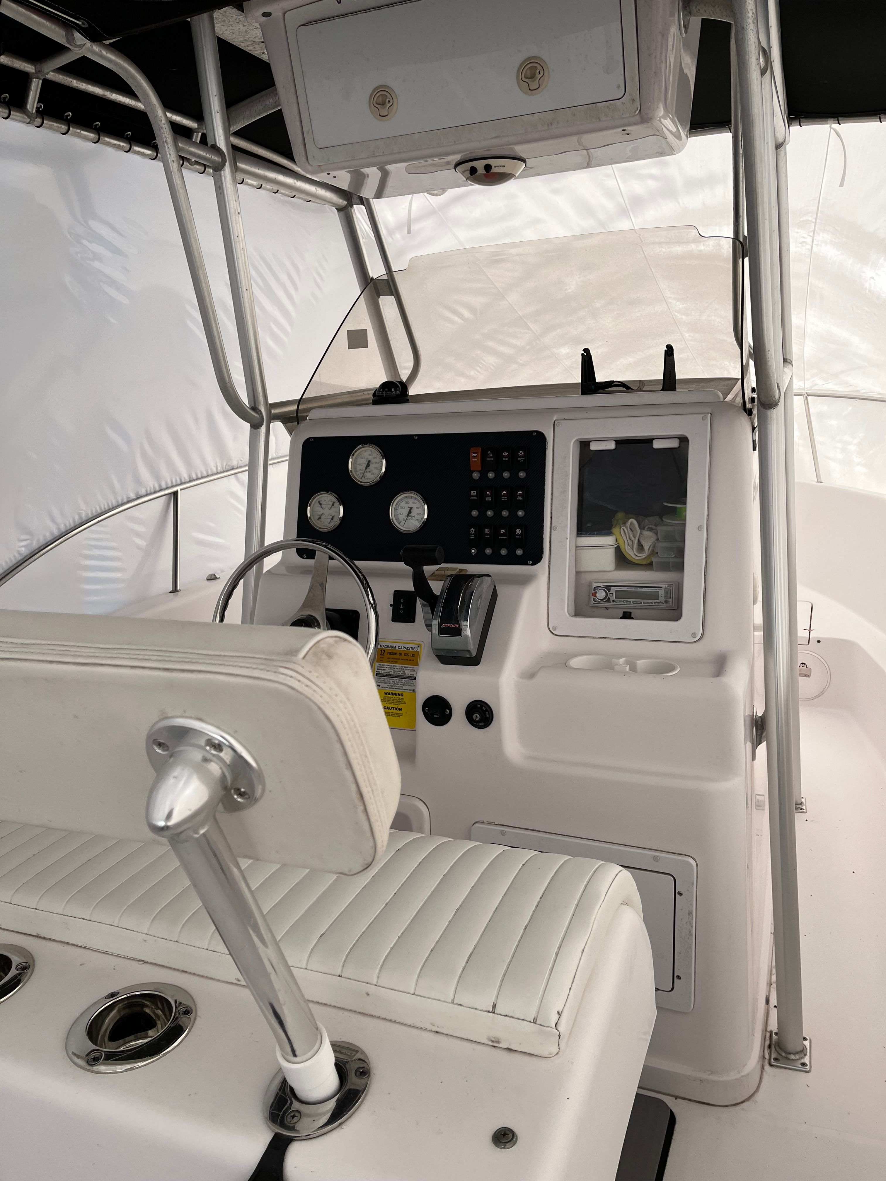 Interior of a 2002 Pro-Line Center Console boat with helm and instruments.