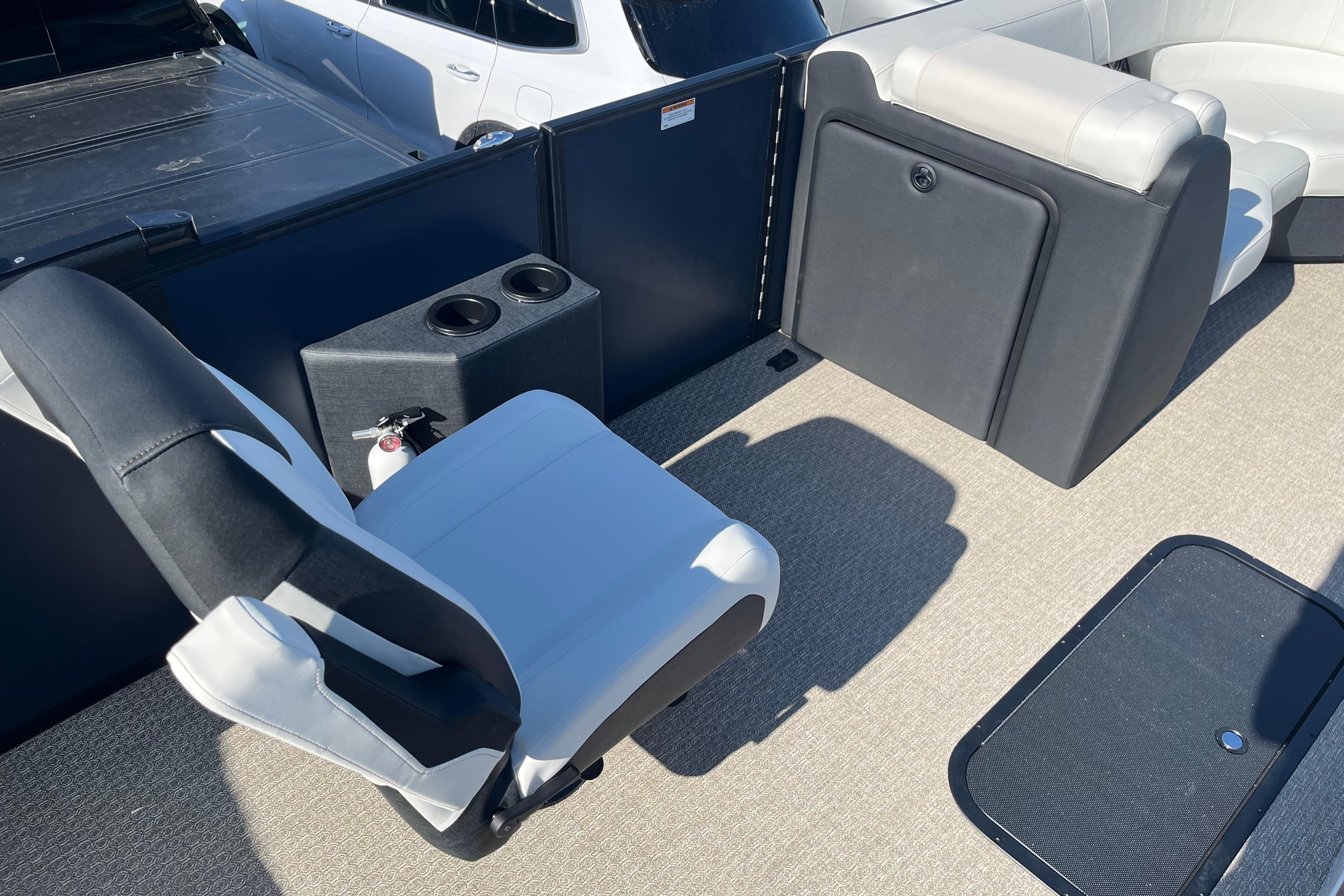 Interior of 2026 Evotti 523CS boat with seating and cup holders.