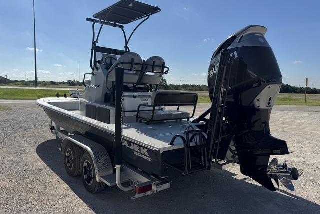 2025 Majek 24 Reaper boat on trailer, featuring a powerful outboard motor.