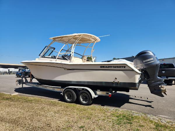 2015 Grady-White Freedom 275 boat on trailer with Yamaha engine, parked outdoors.