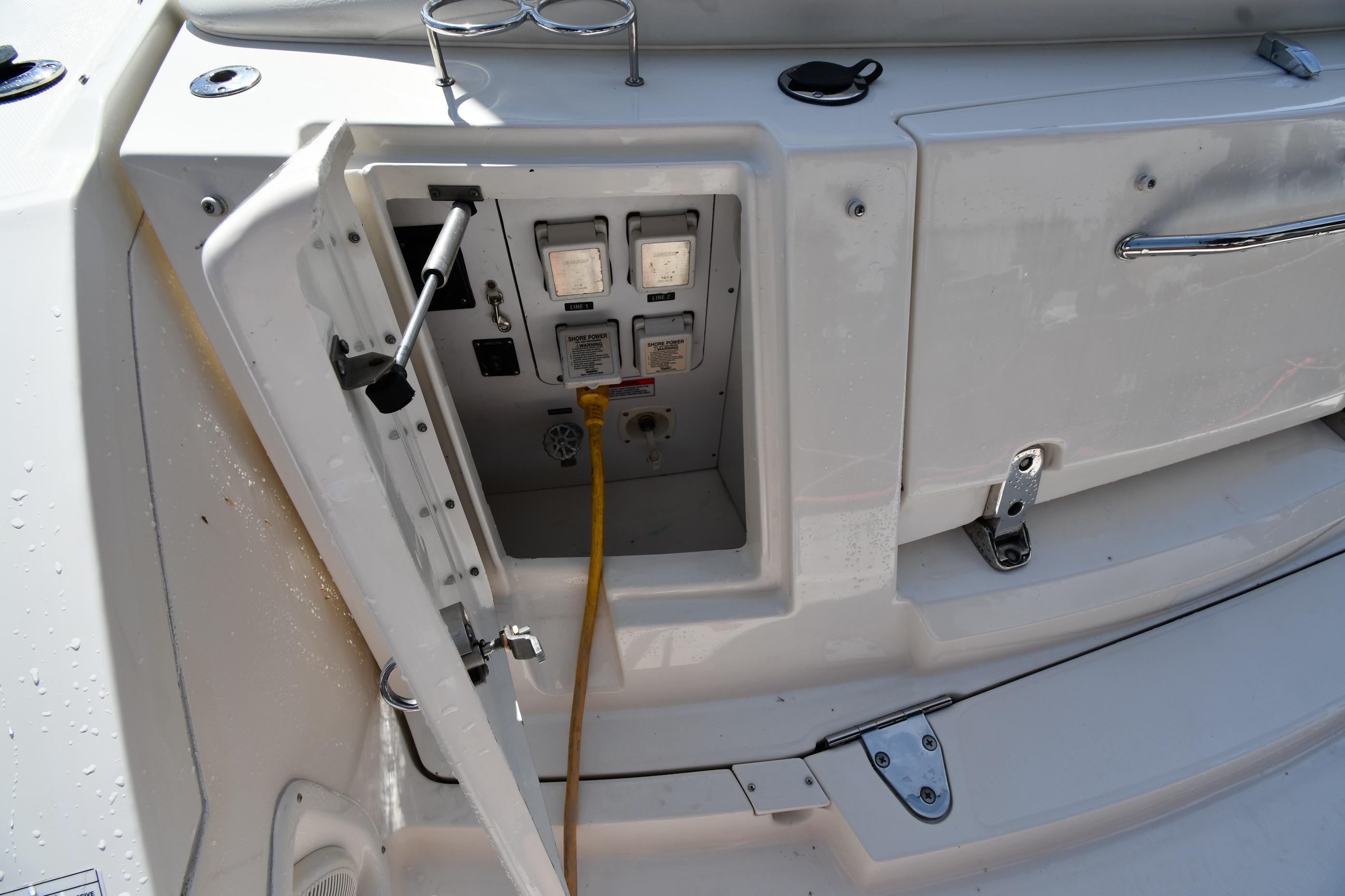 Electrical panel on a 2008 Sea Ray Sundancer 350 boat with open access door.