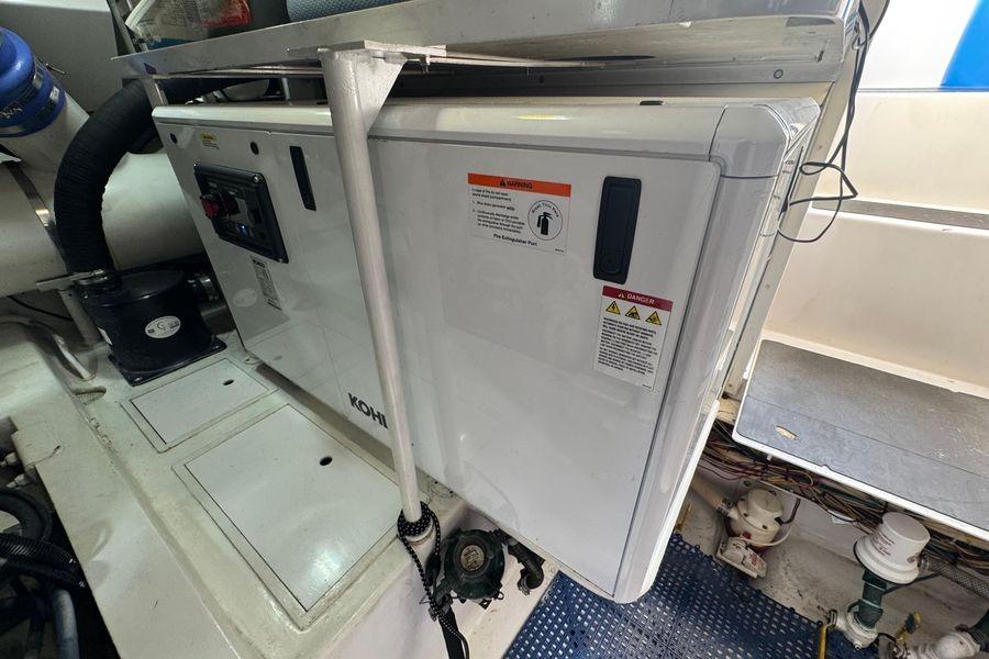 Engine room of 2002 Viking 61 Enclosed Bridge yacht with Kohler generator.