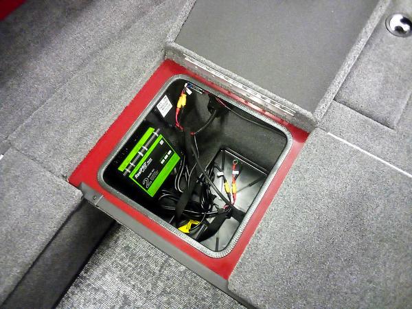Battery compartment of 2025 Ranger VS1665 SC boat, featuring wiring and storage.