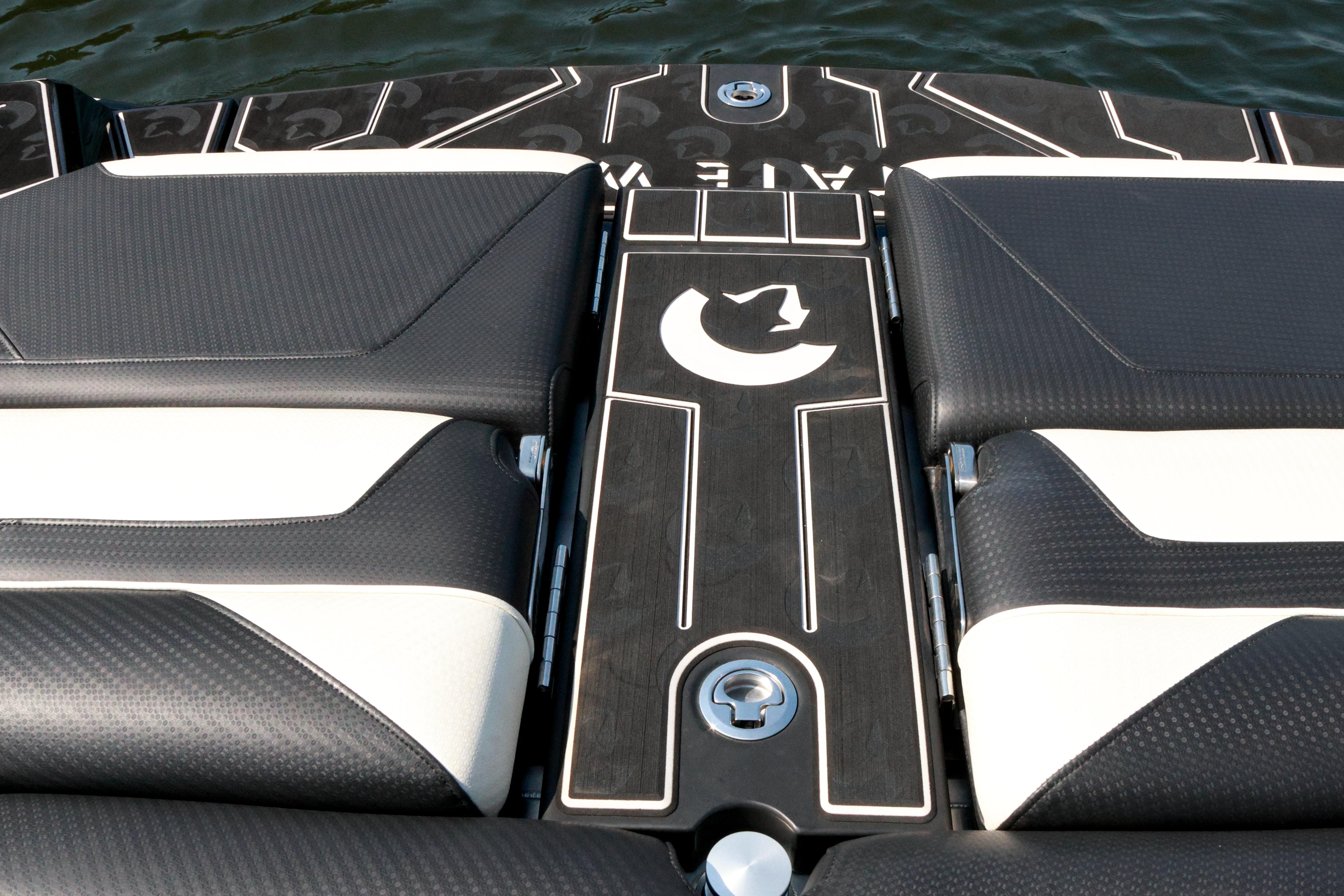 2022 Centurion Ri265 boat interior with sleek black and white seating design.