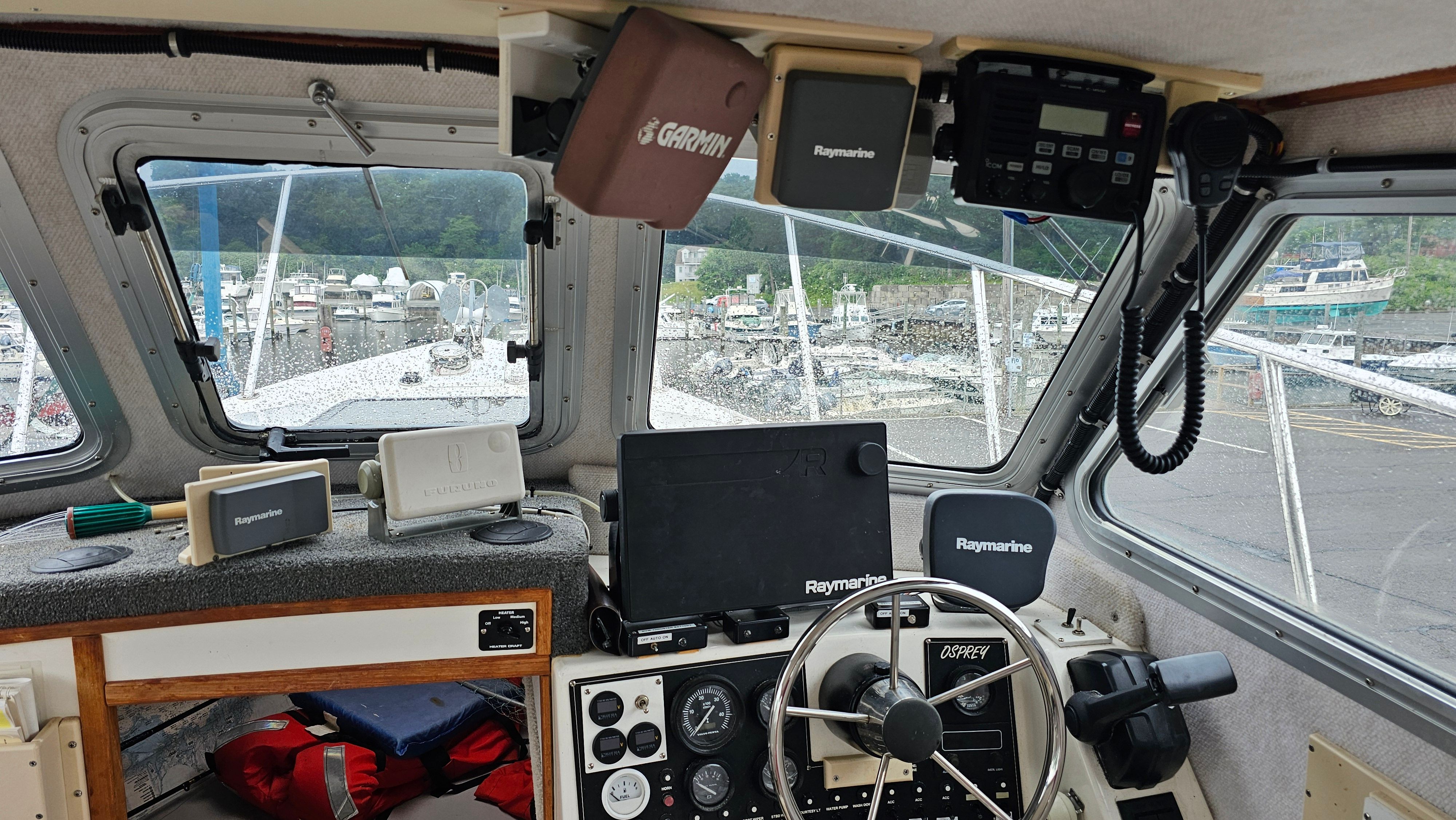 Interior of a 2004 Osprey 26 EXPEDITION boat with navigation equipment.