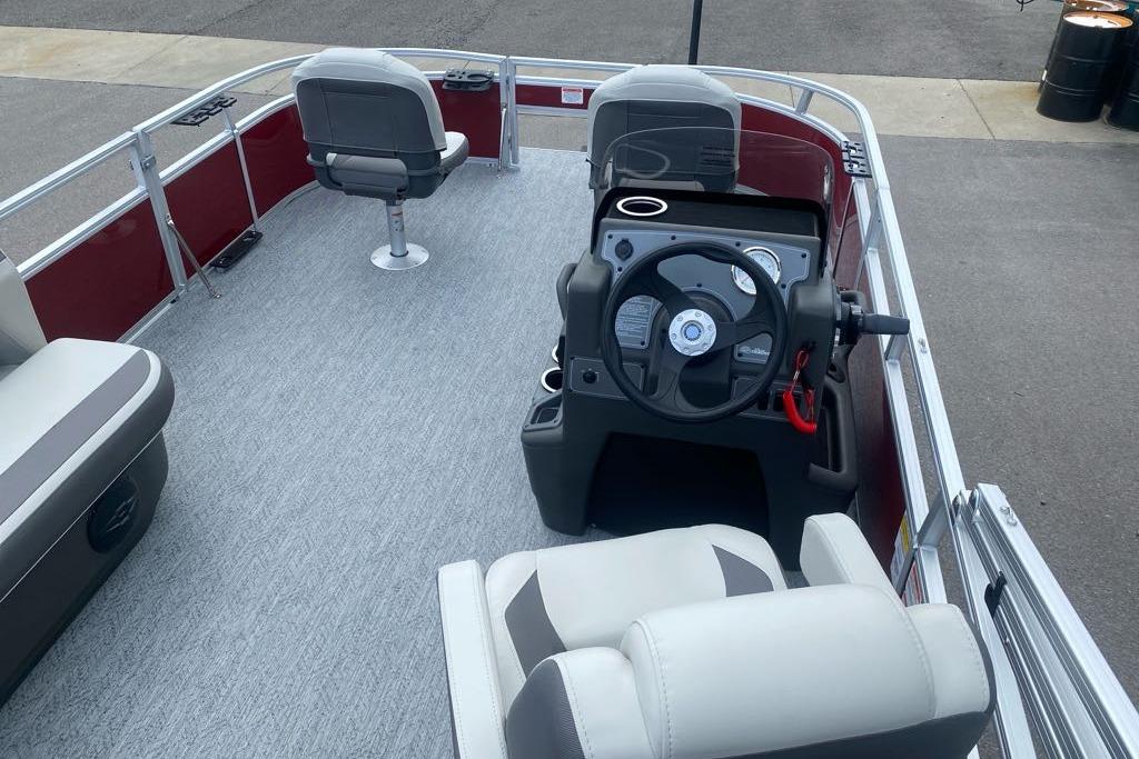 2026 Sun Tracker Bass Buggy 16 XL Select pontoon boat interior with steering console.