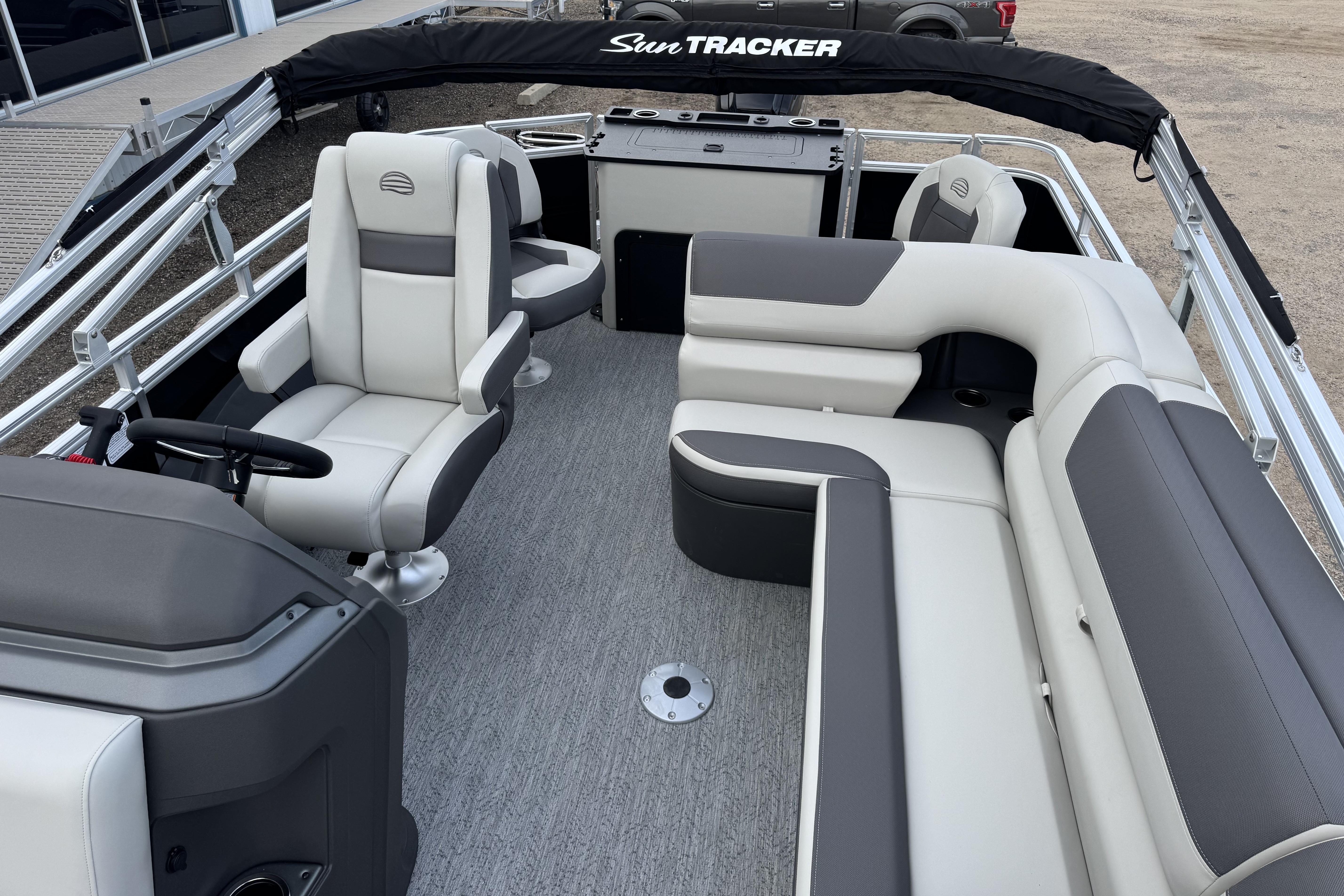2026 Sun Tracker Fishin' Barge 22 DLX interior with plush seating and modern design.