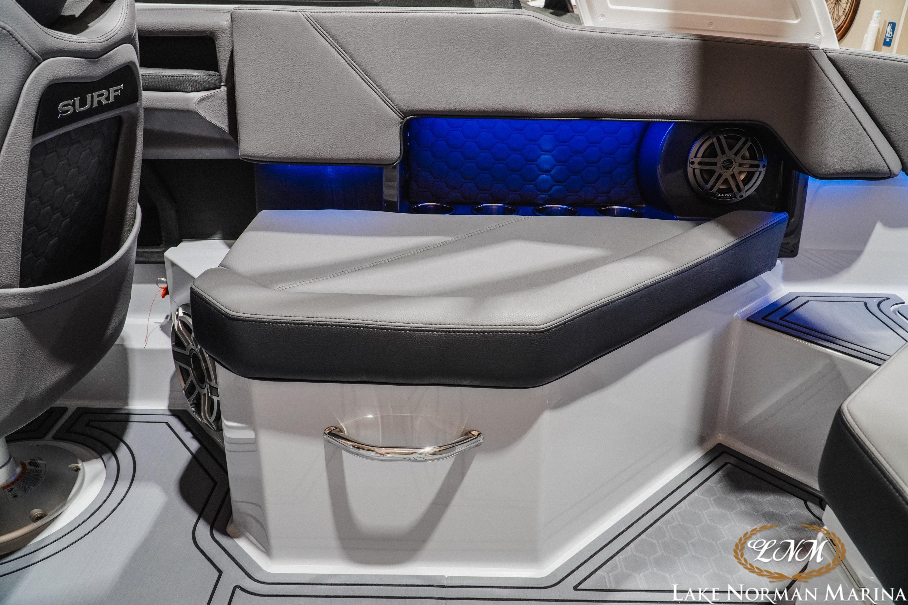 2026 Cobalt R4 Surf boat interior with sleek seating and blue LED lighting.
