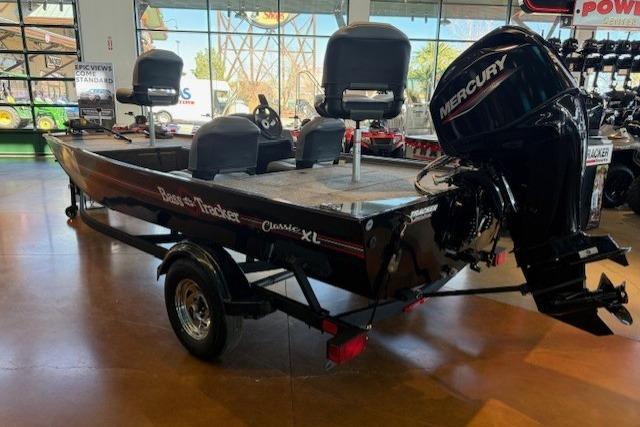 2026 Tracker Bass Tracker Classic XL boat with Mercury engine in showroom.