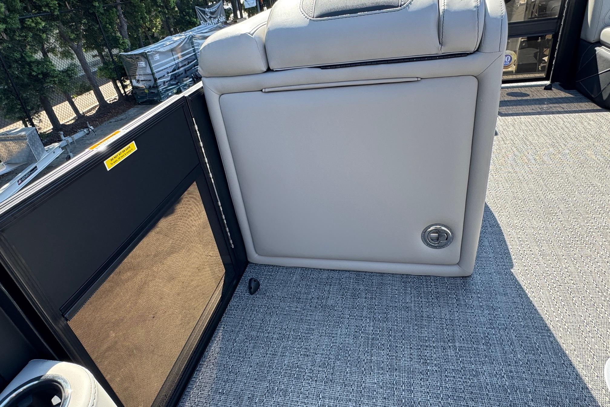 2026 Barletta Cabrio 22UC boat interior with gray upholstery and carpeted flooring.