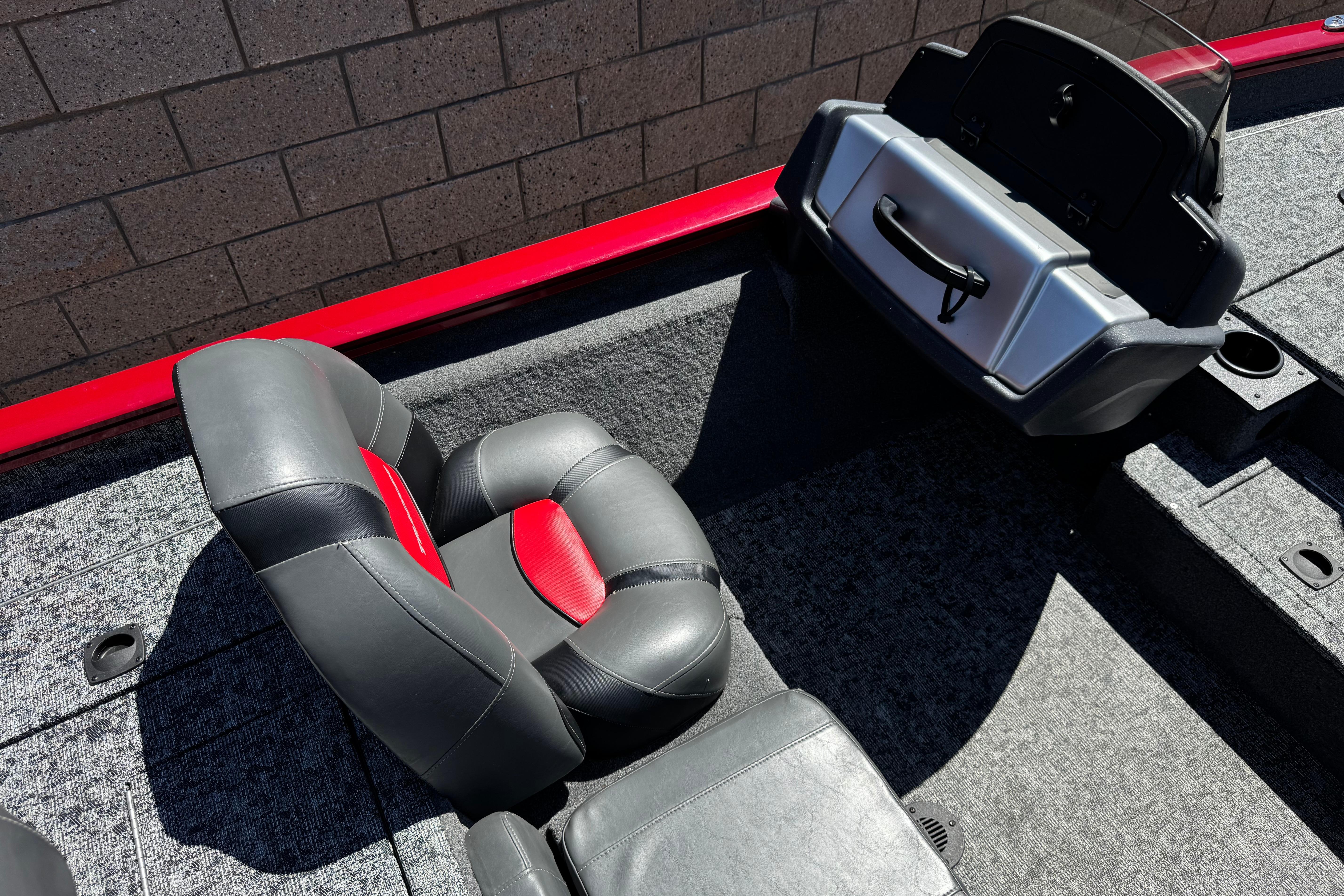 2025 Tracker Pro Team 175 TXW boat interior with gray and red seating.
