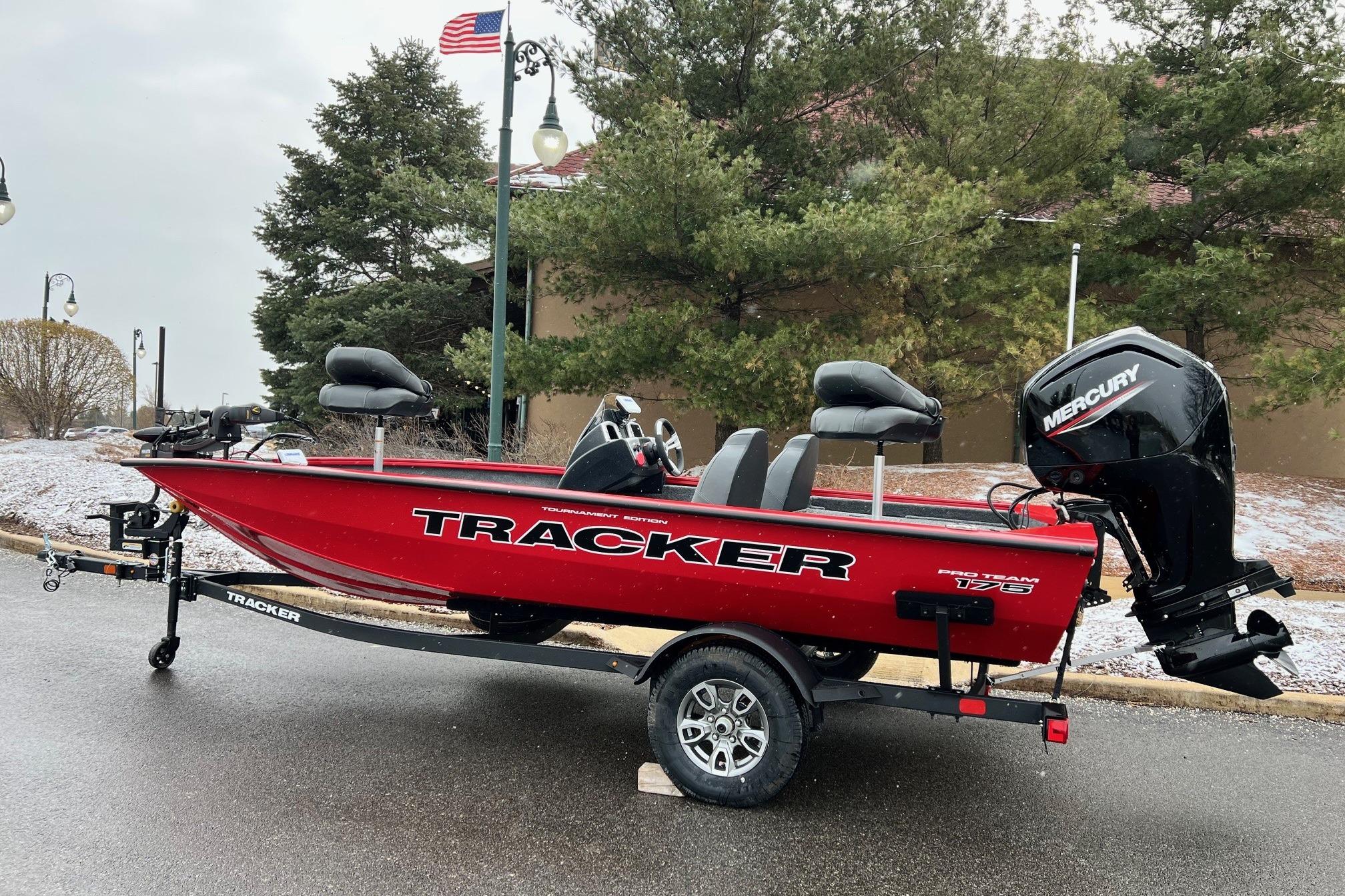 2026 Tracker Pro Team 175 boat with Mercury engine on trailer, parked outdoors.