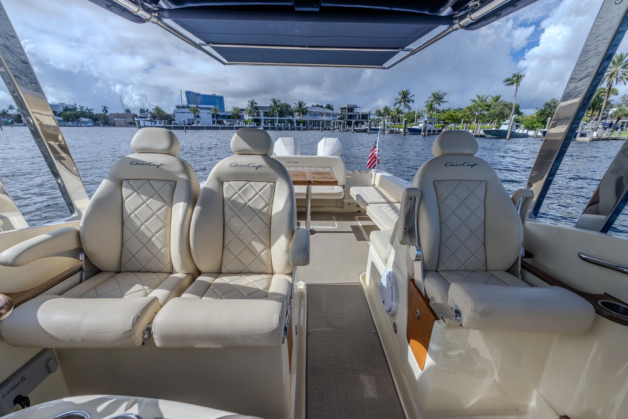 Interior of a 2019 Chris-Craft Calypso 30 boat with luxurious seating.