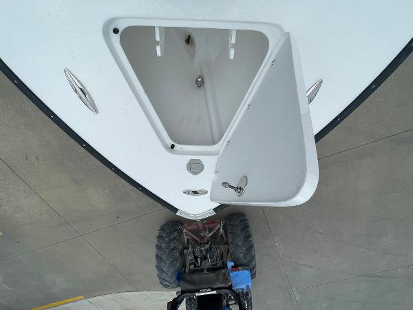 Open hatch on 2026 Cape Horn 24XS boat, viewed from above.