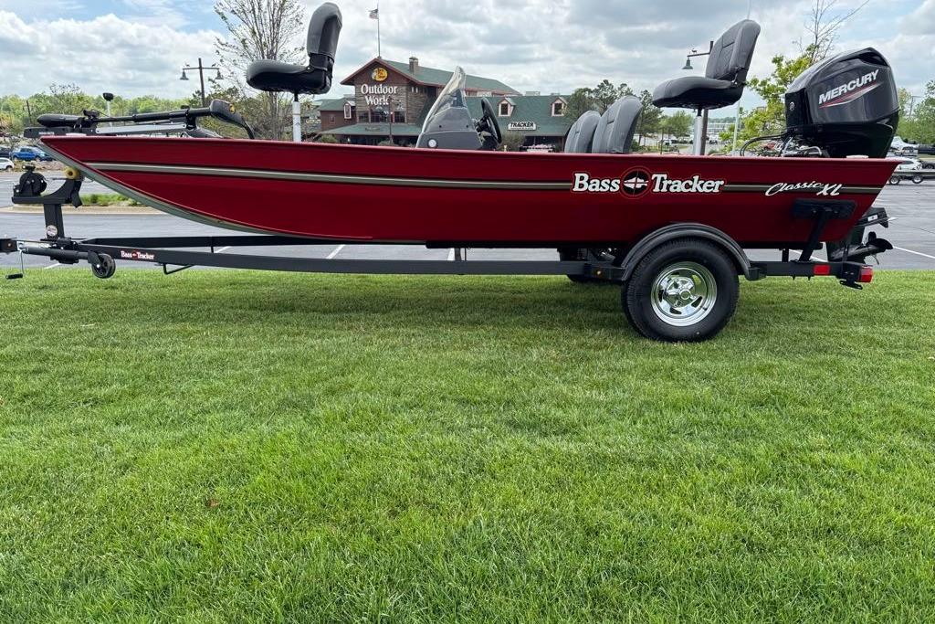 2026 Tracker Bass Tracker Classic XL boat on trailer, parked on grass.