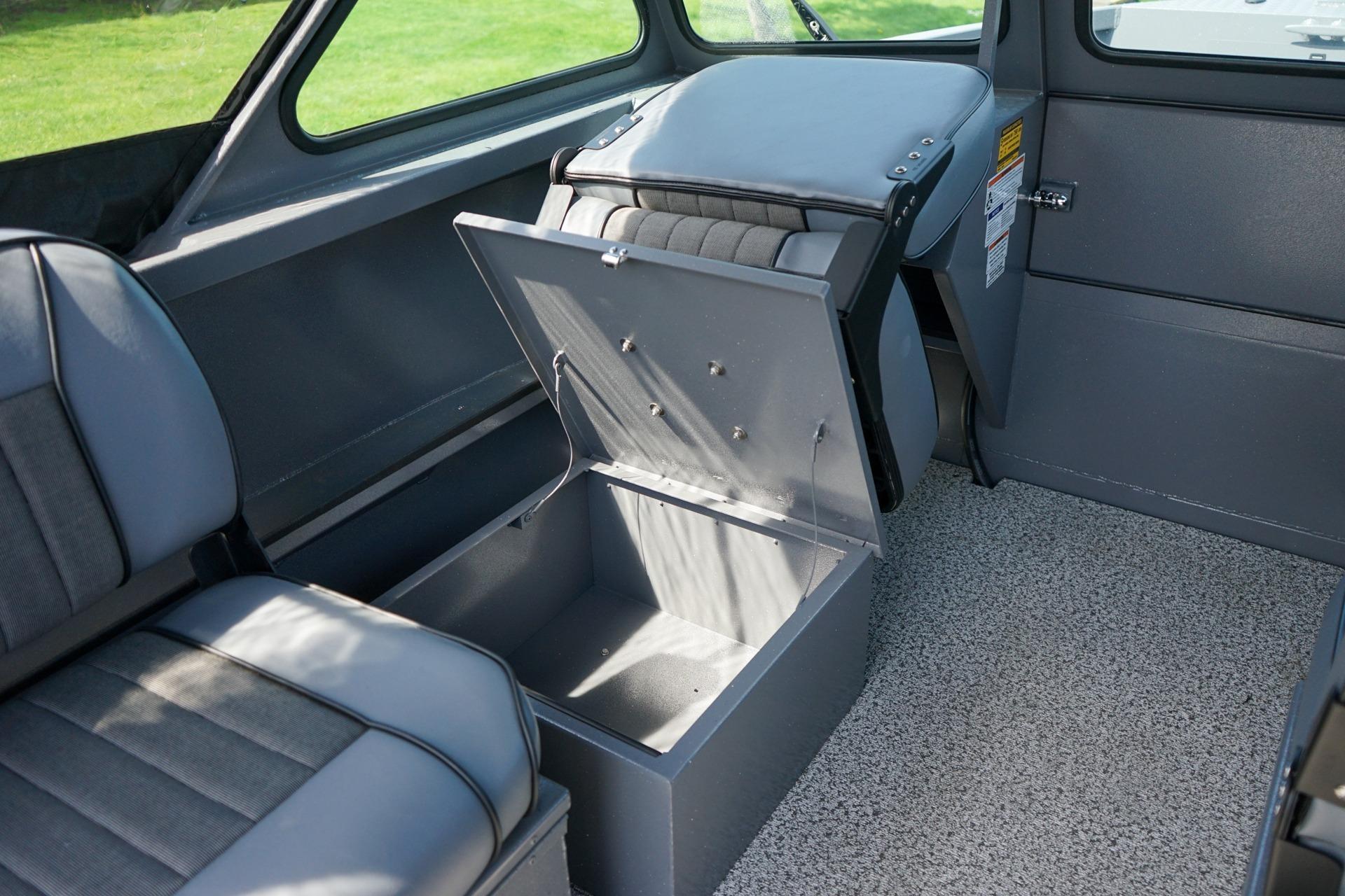 2026 Alumaweld Talon 18 interior with open storage compartment and gray seating.