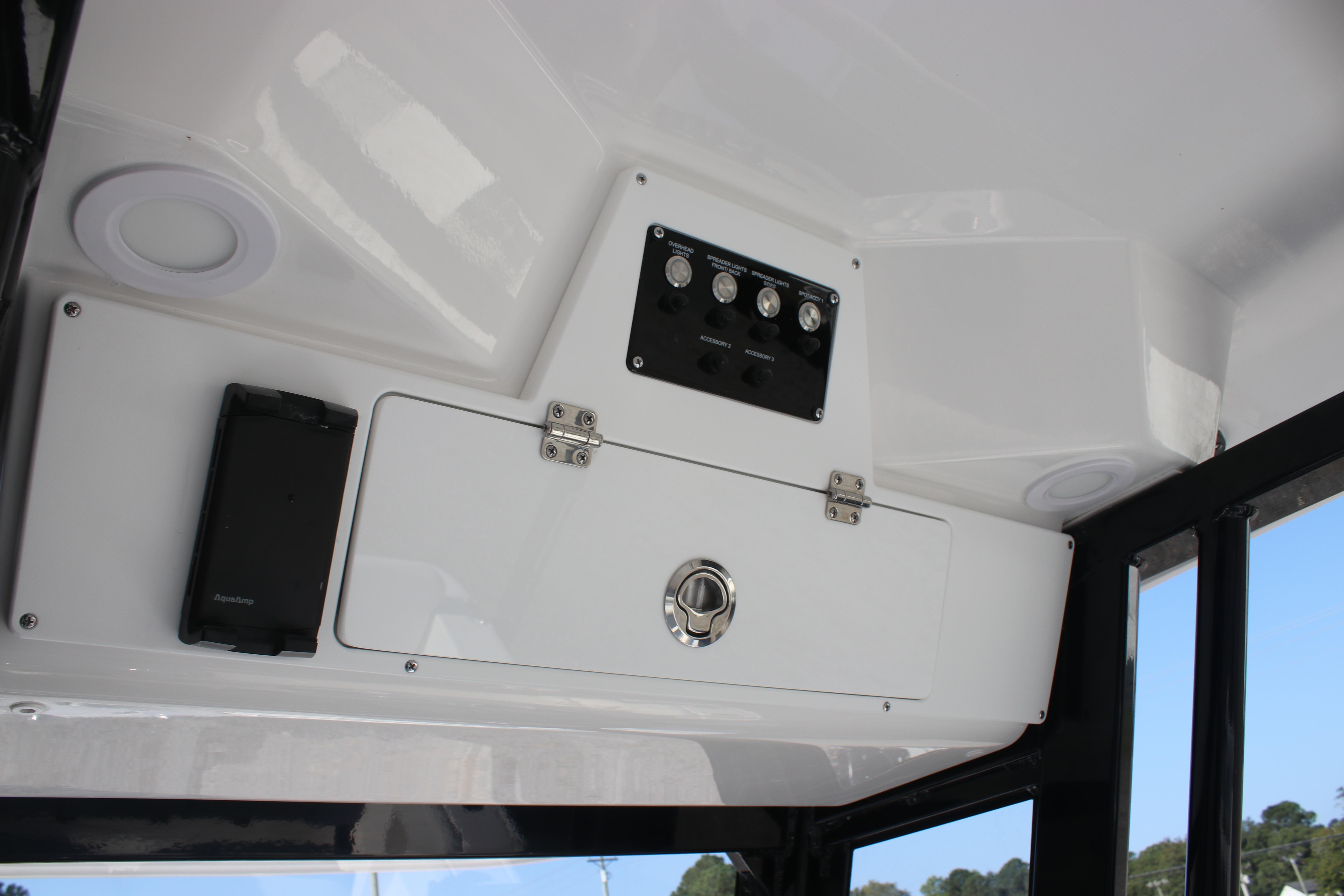 2026 Sea Fox 248 Commander boat interior control panel and storage compartment.