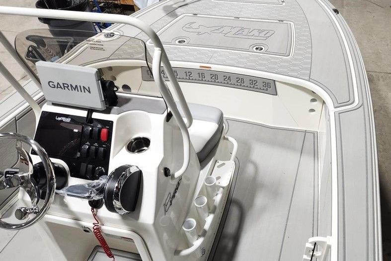 2026 Mako 18 Pro Skiff boat interior with Garmin navigation system and steering console.