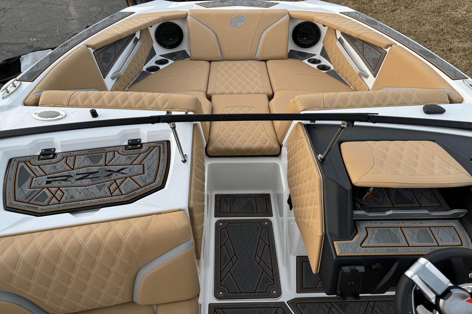 2024 Tigé RZX22 boat interior with tan diamond-stitched upholstery and modern design.