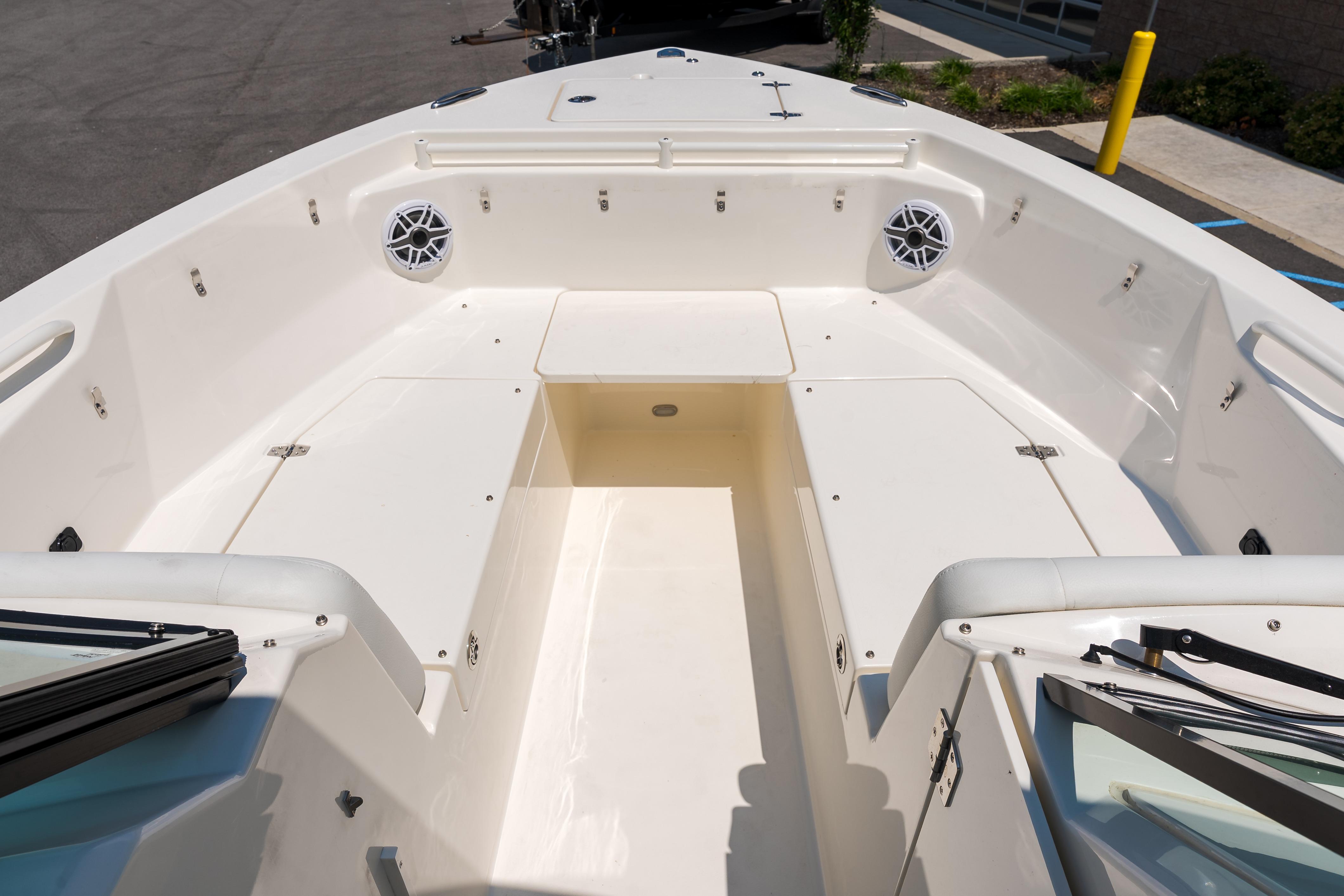 2023 Cobia 240 Dual Console boat interior with spacious seating and storage compartments.