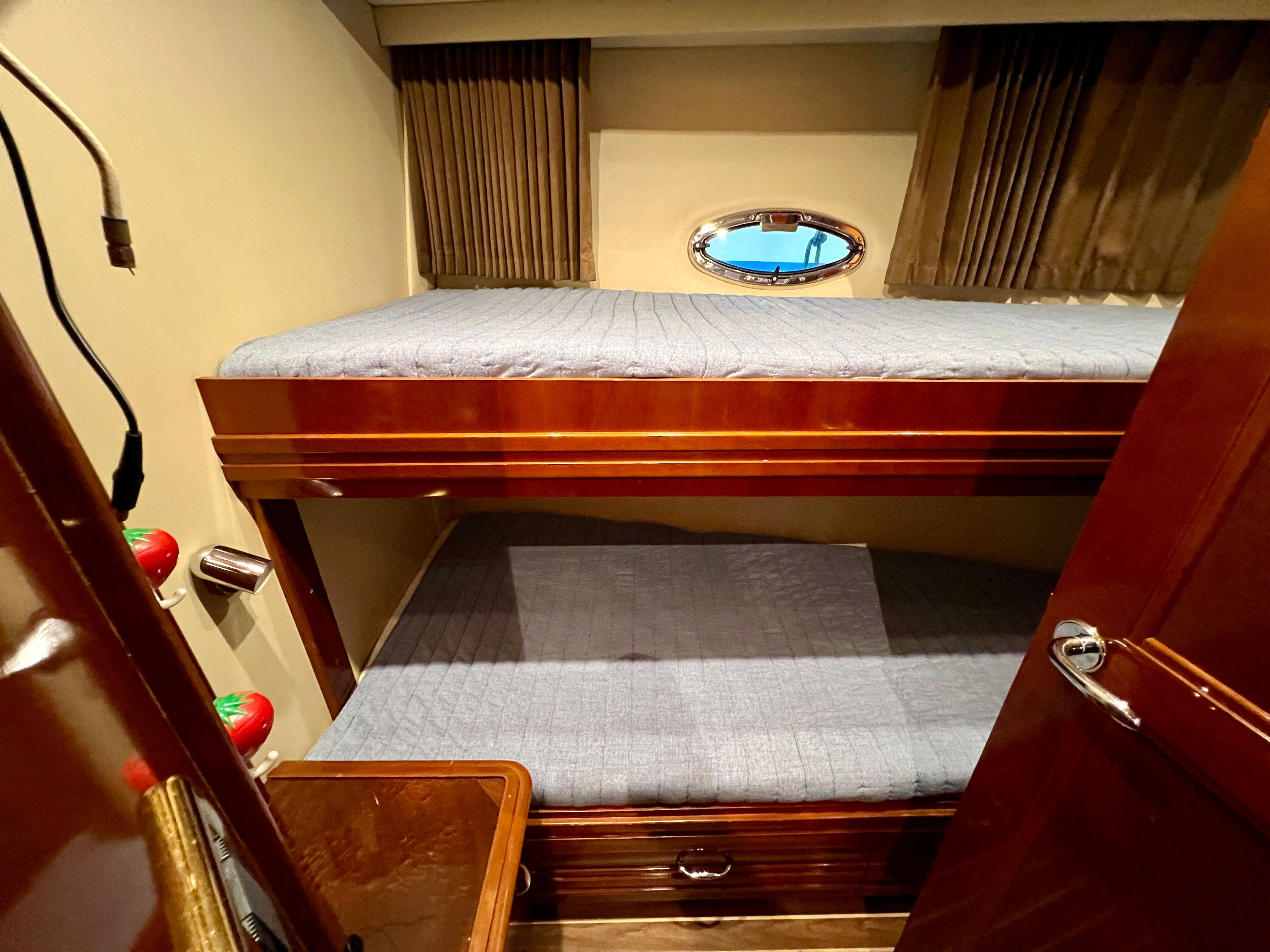 Interior of 2005 Carver 560 Voyager Sky with bunk beds.