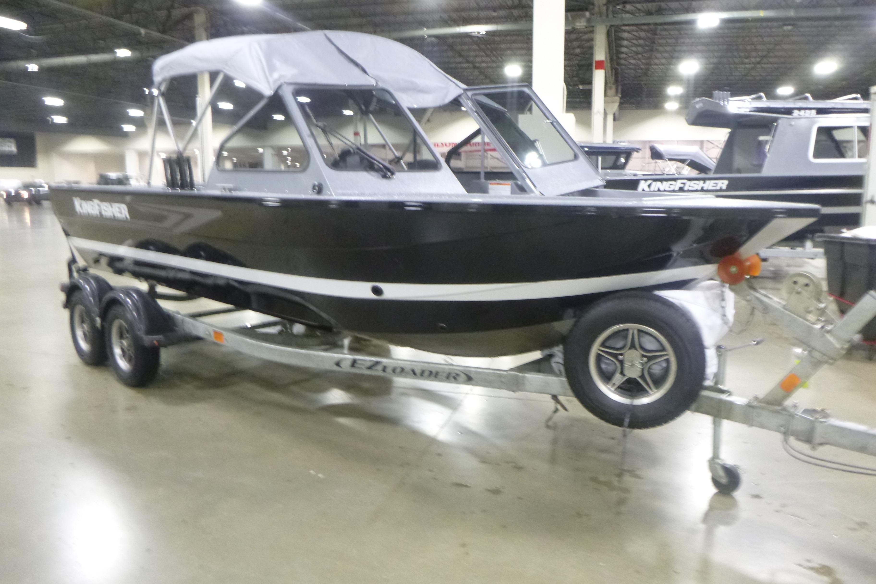 KingFisher 2025 Falcon boat on trailer in indoor showroom, 2026 model.