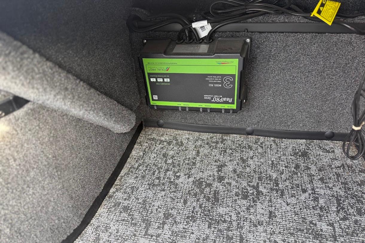 Interior of 2026 Ranger VS1882SC Reata with battery charger installed.