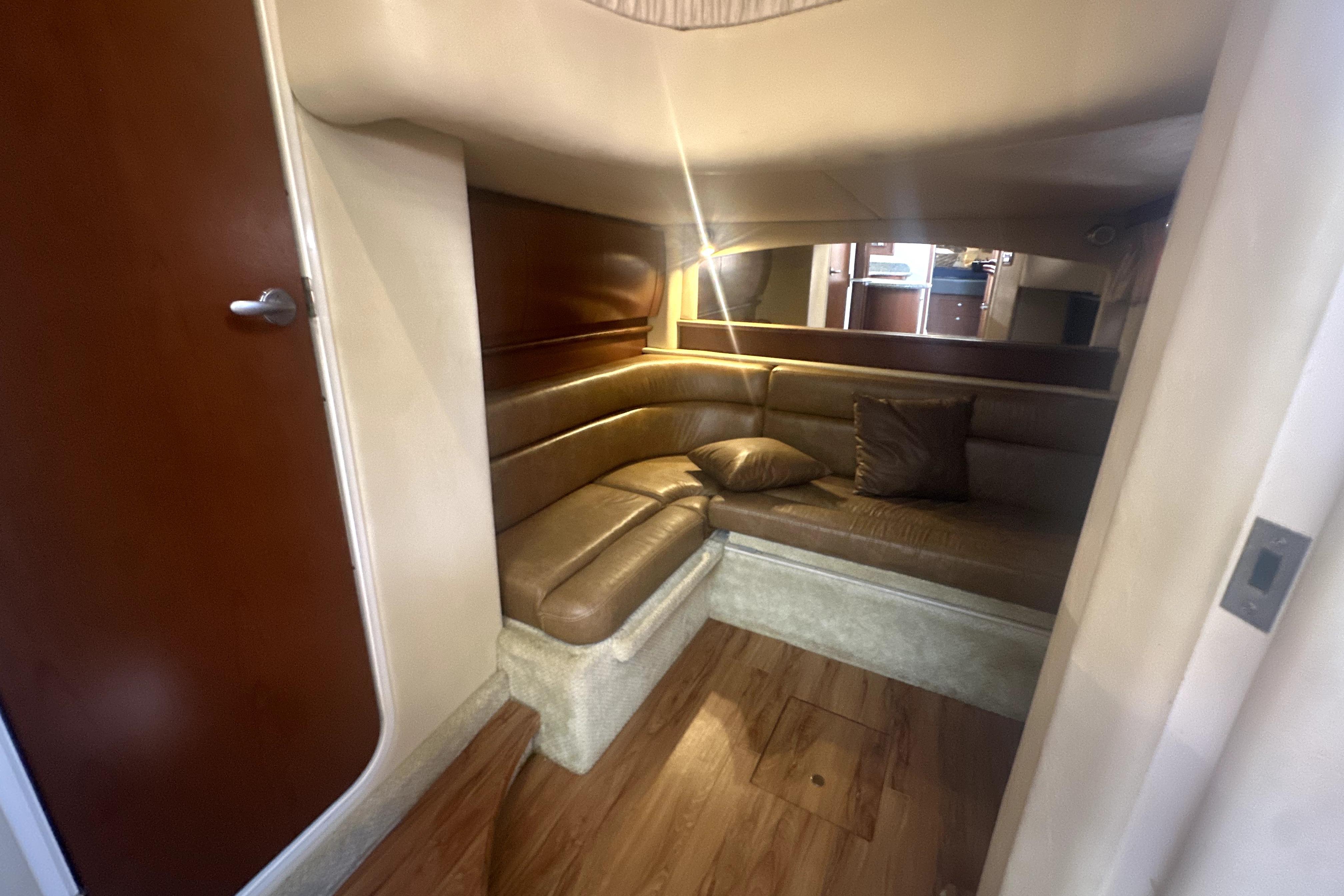Interior of 2007 Sea Ray 44 Sundancer yacht with cozy leather seating area.