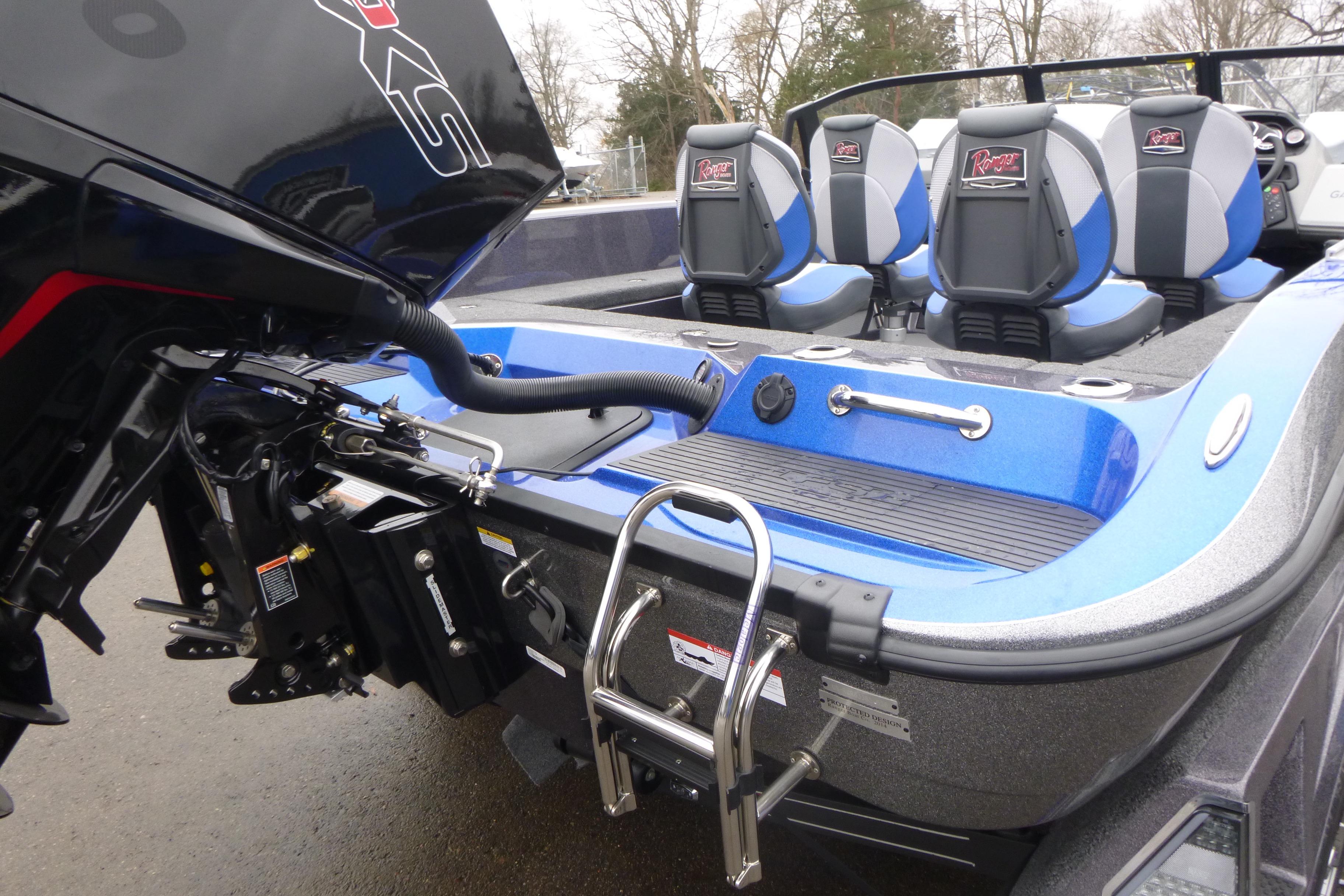 2026 Ranger 620FS Cup Equipped boat with blue seats and powerful motor.