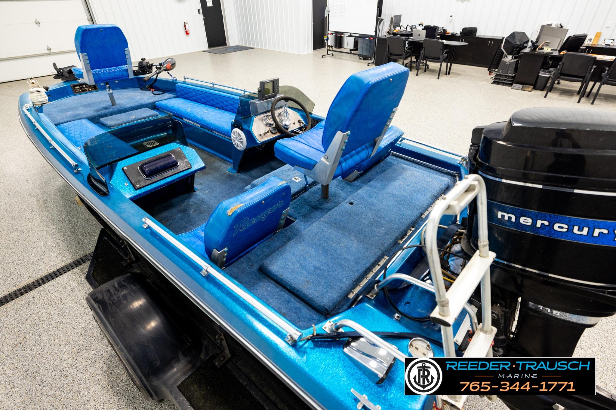 1980 Ranger 175 VS boat with blue interior and Mercury outboard motor in showroom.