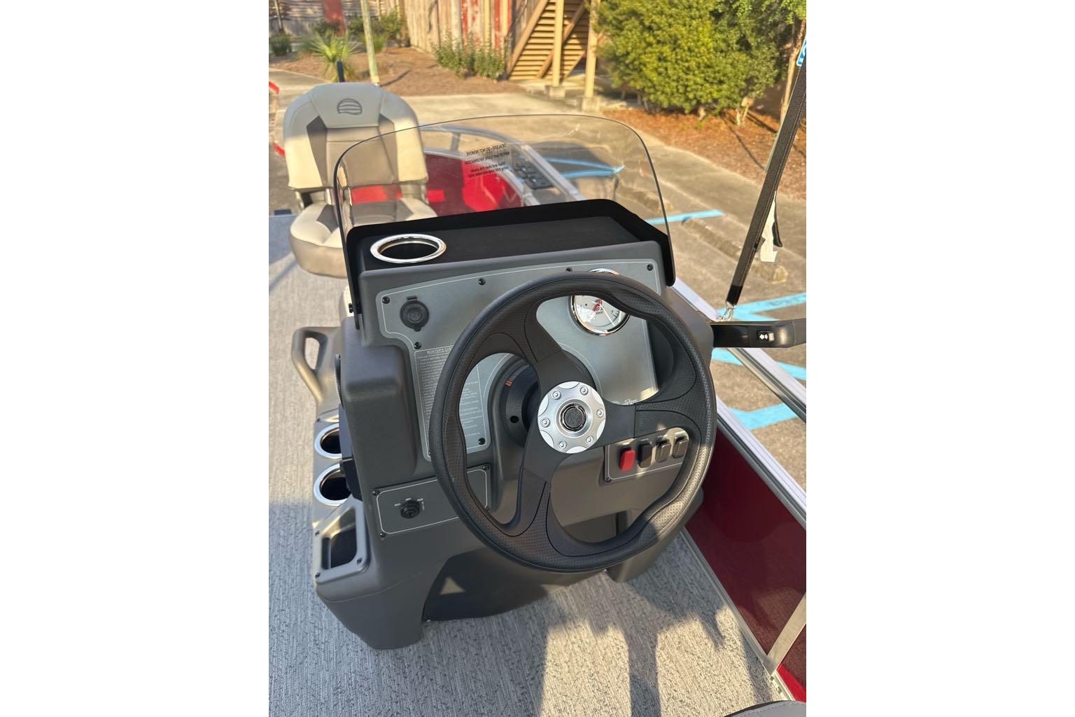 2026 Sun Tracker Bass Buggy 16 XL Select boat dashboard with steering wheel and controls.