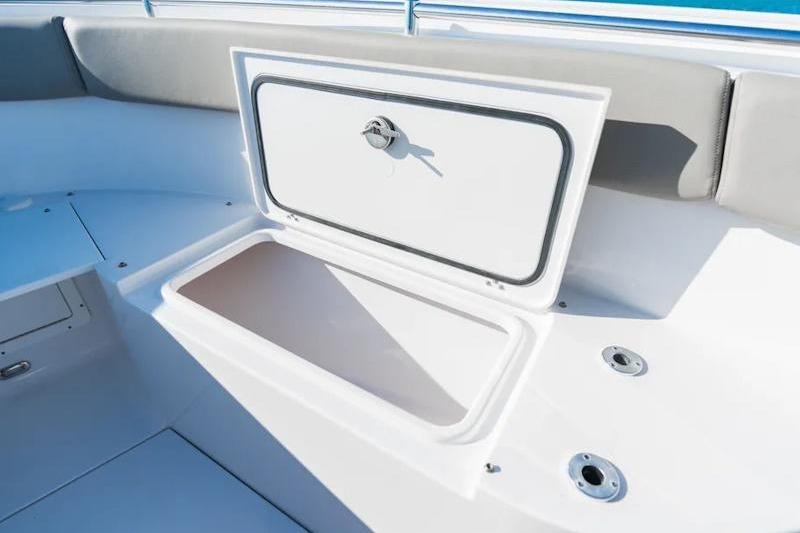 2026 Sportsman Open 282 Center Console boat storage compartment open.