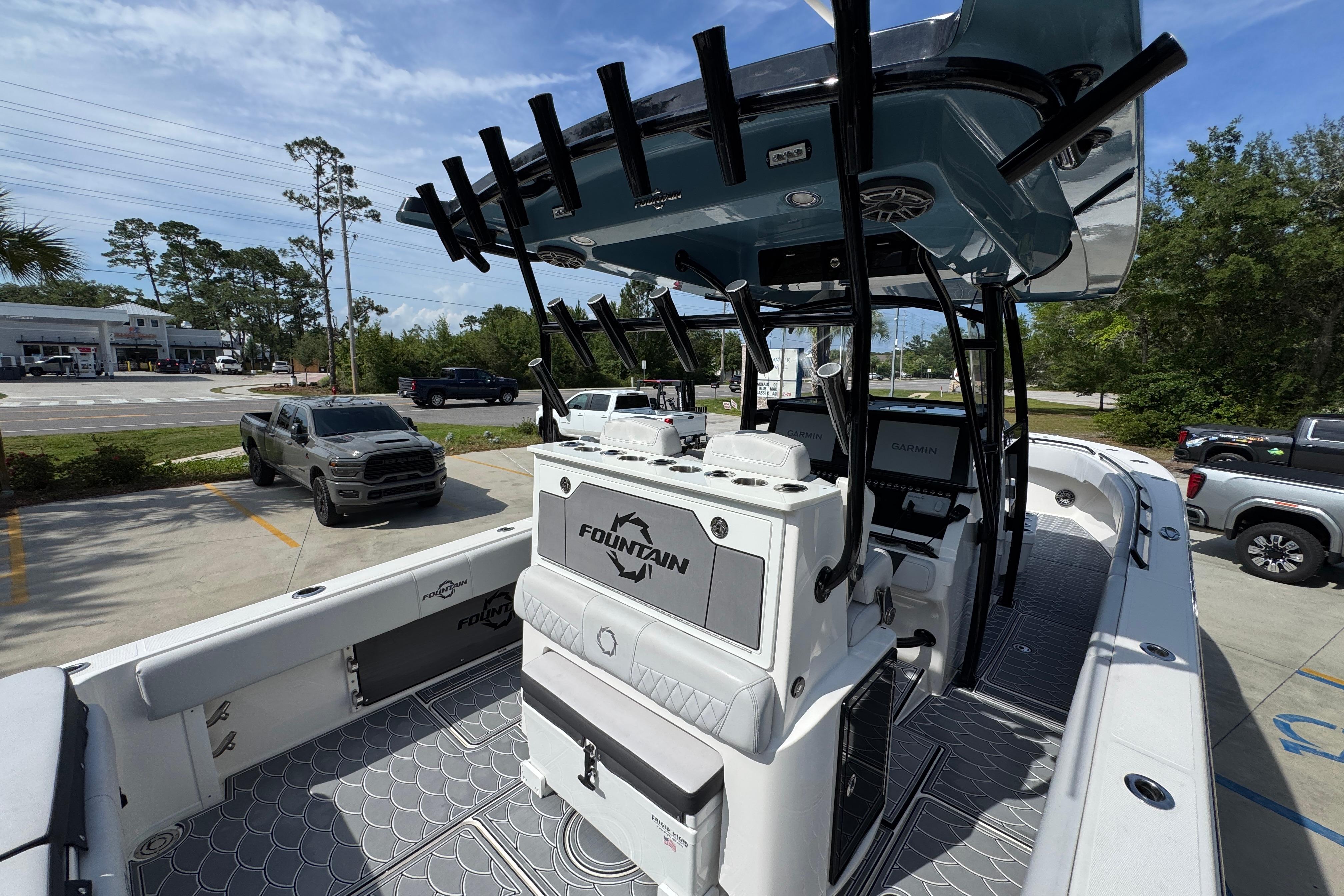 2023 Fountain 34 Tournament Edition boat with advanced navigation, parked in a lot.