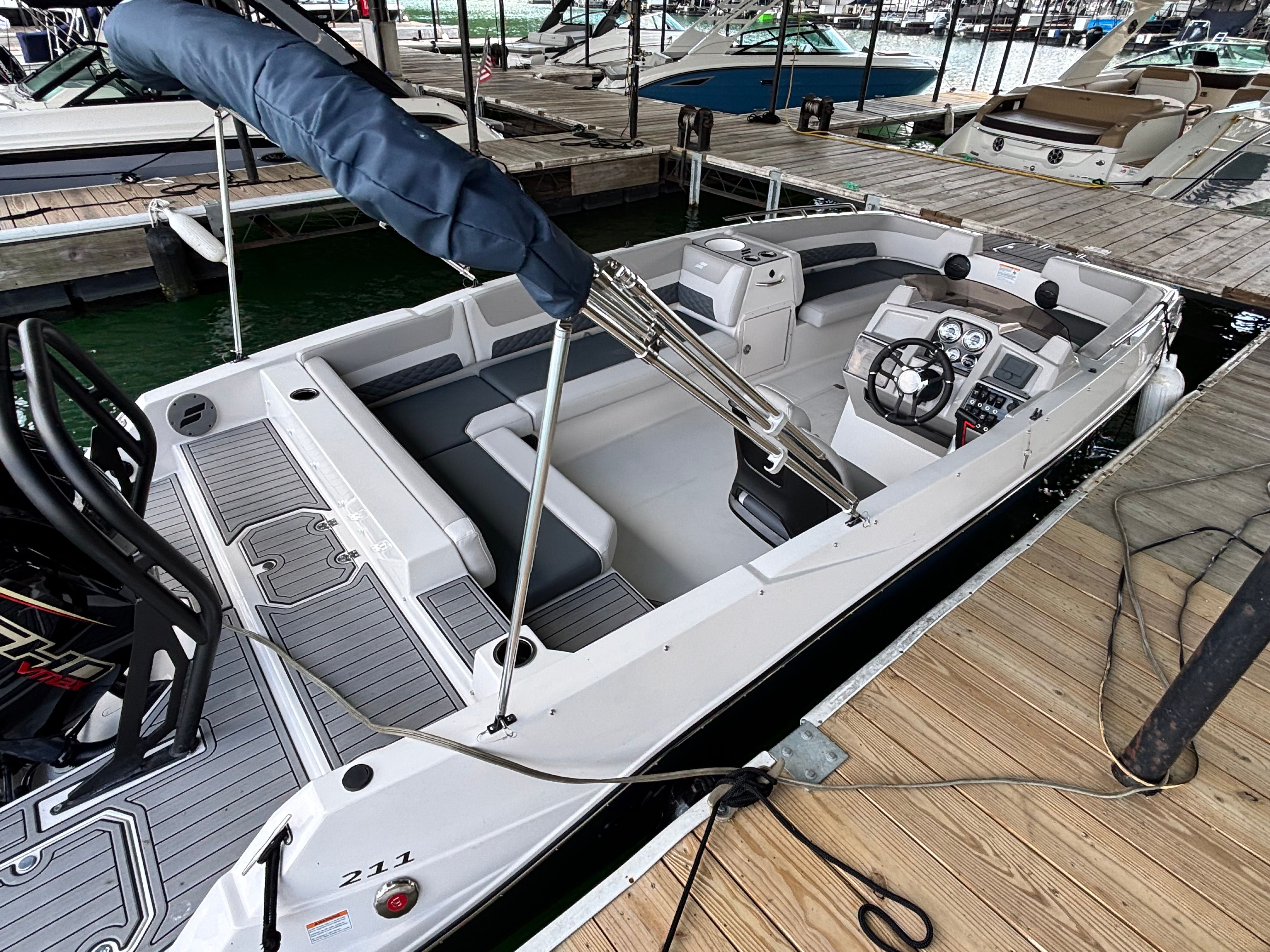 A 2027 Starcraft 211SVXOB docked. It features a modern design and comfortable seating.