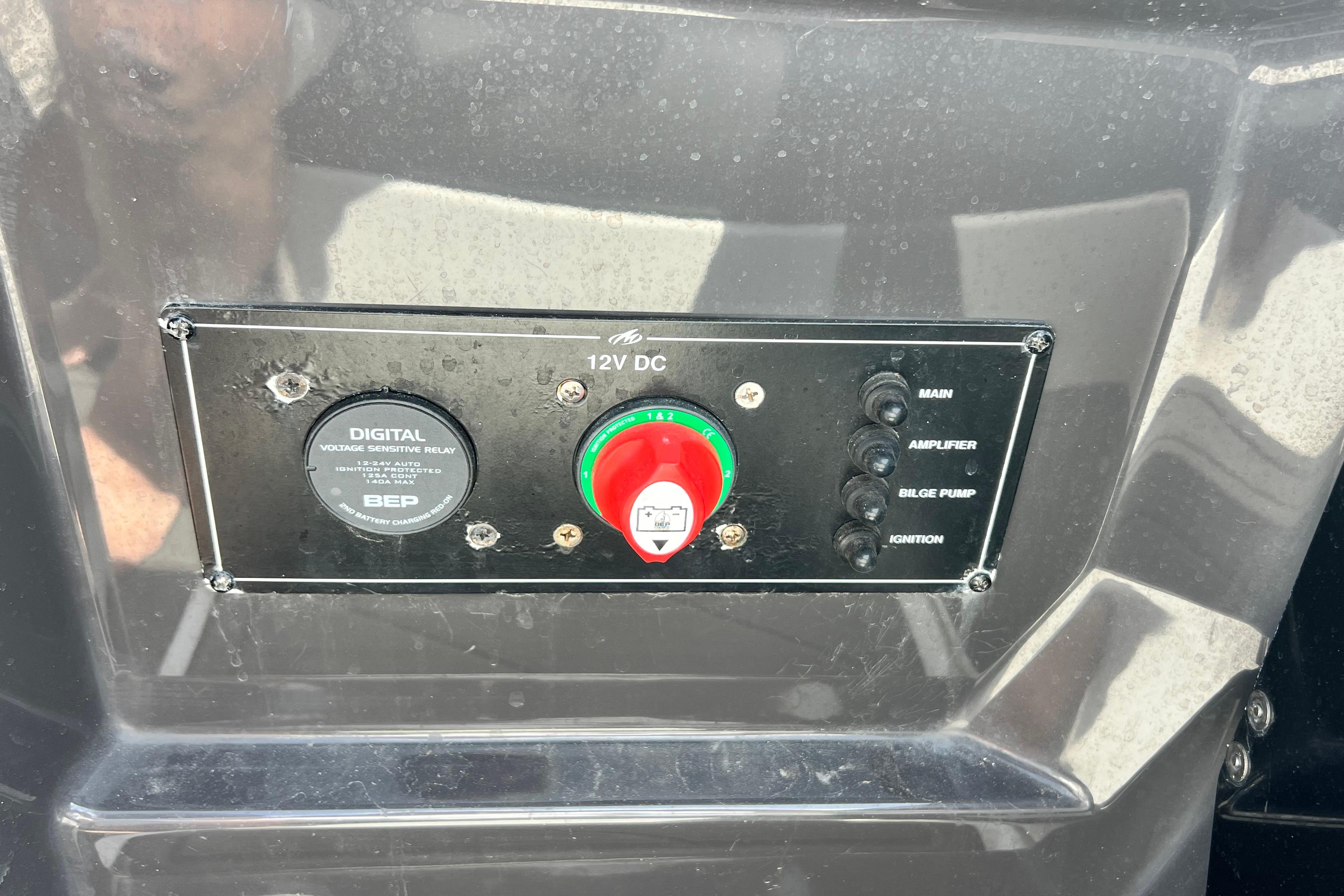 Control panel of a 2015 Monterey 268SS Super Sport boat with switches and voltage relay.