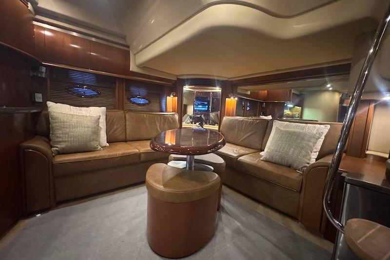 Luxurious interior of 2005 Sea Ray 500 Sundancer yacht with leather seating and elegant lighting.