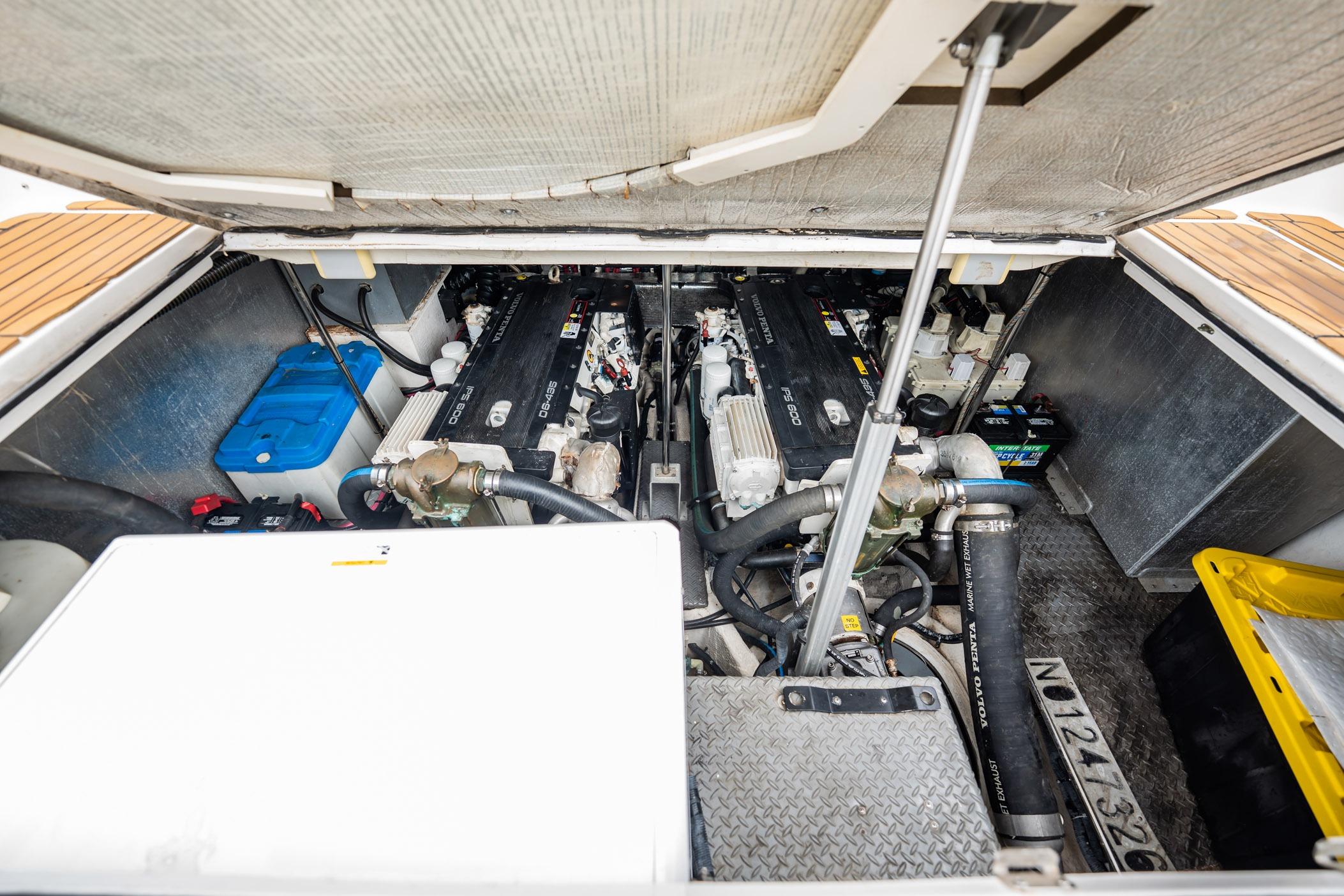 Engine compartment of a 2008 Regal Commodore 4460 boat, showcasing dual engines and components.