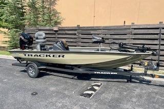 2026 Tracker Pro Team 190 boat on trailer, parked outdoors.