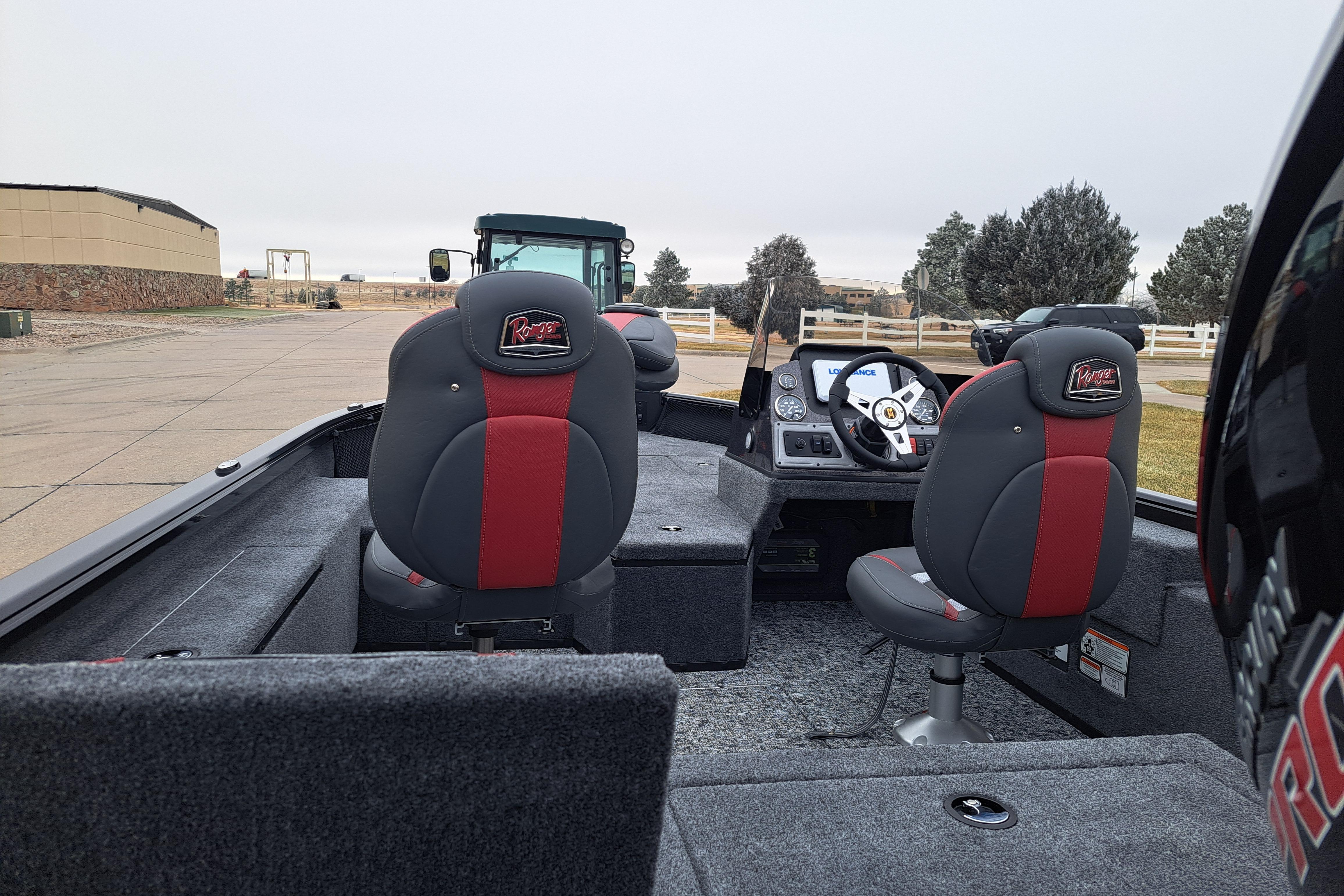 2026 Ranger VS1782SC Reata boat interior with red and gray seating, dashboard view.