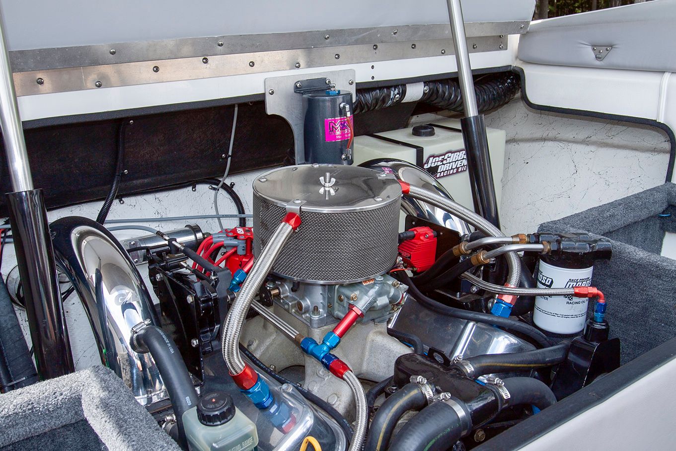 Engine compartment of a 1995 Mirage Trovare 275 boat, showcasing engine and components.