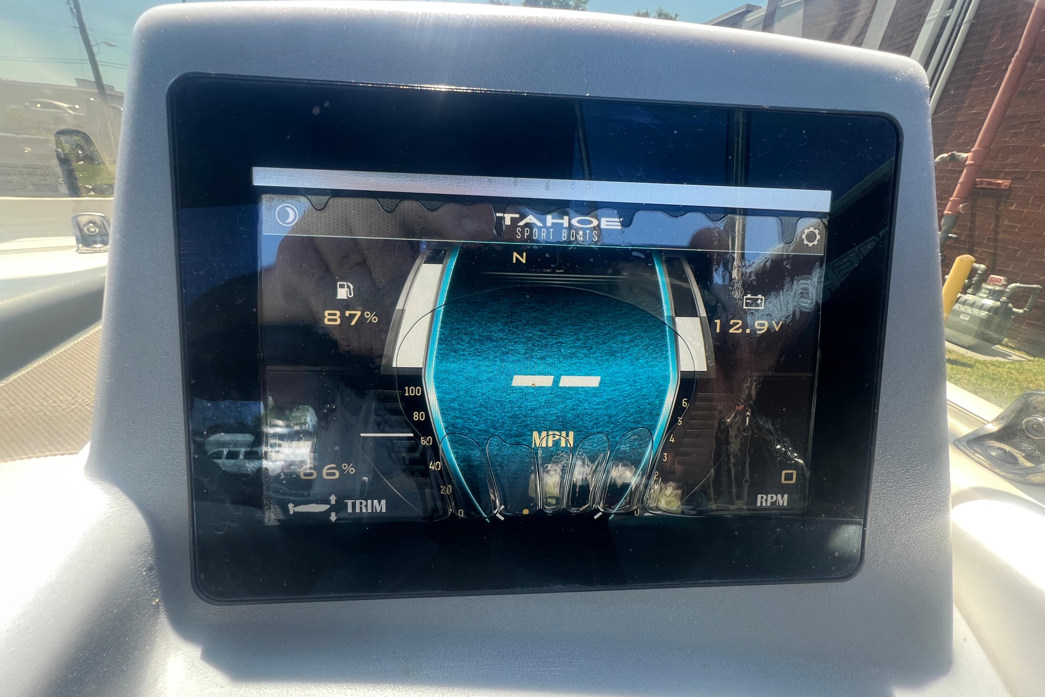 Dashboard display of a 2023 Tahoe T16 boat showing fuel, voltage, and RPM.
