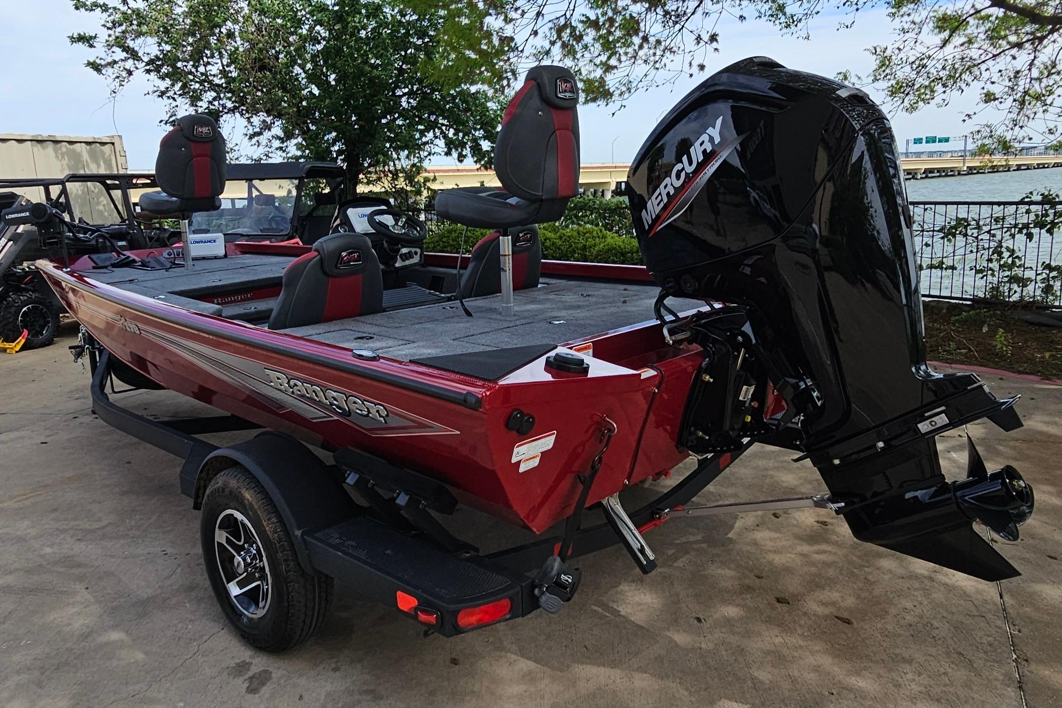 2026 Ranger RT178 boat with Mercury engine, parked outdoors near water.