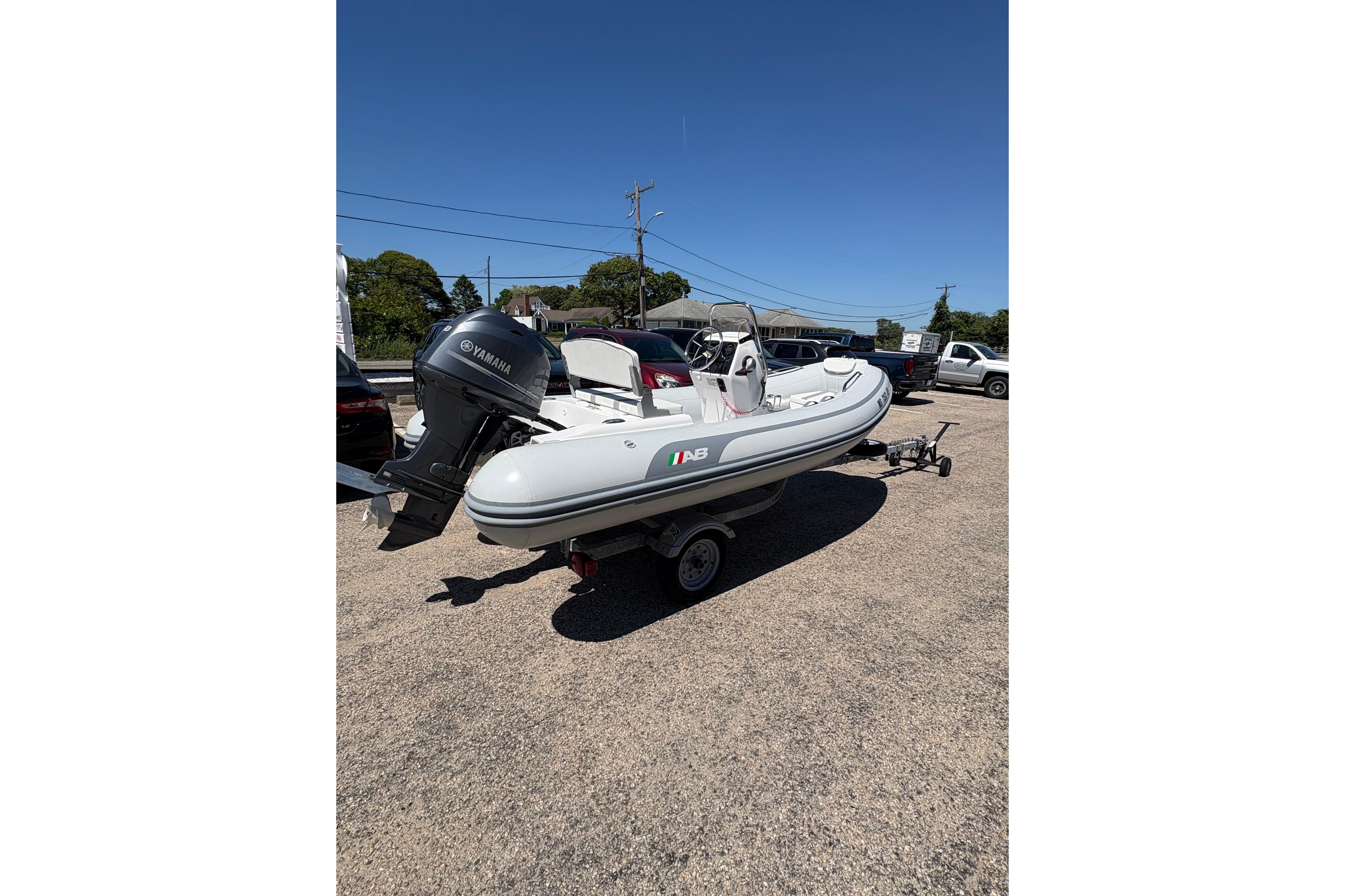 2022 AB Inflatables Oceanus 14 VST boat on trailer, featuring Yamaha outboard motor.