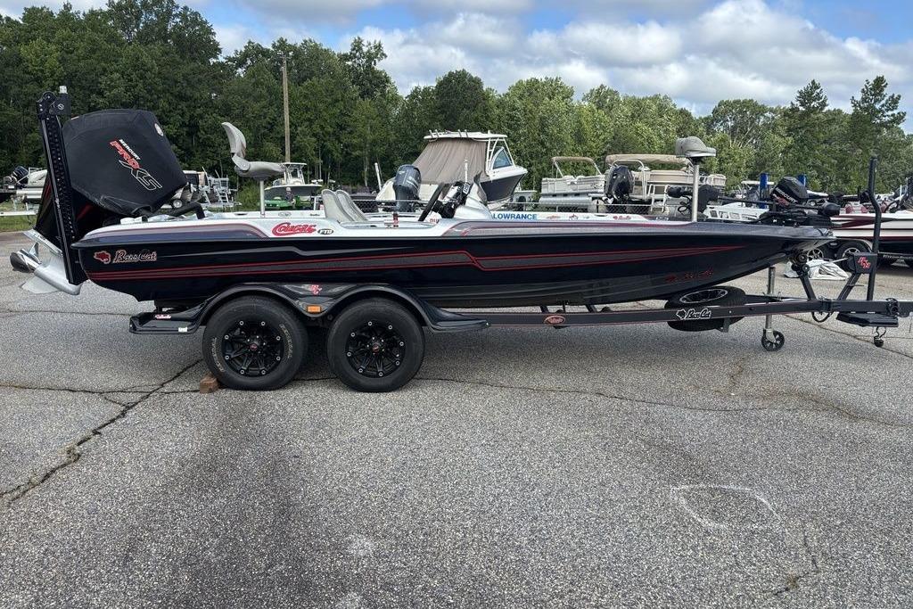 2020 Bass Cat Cougar FTD boat on trailer, parked outdoors with trees in background.